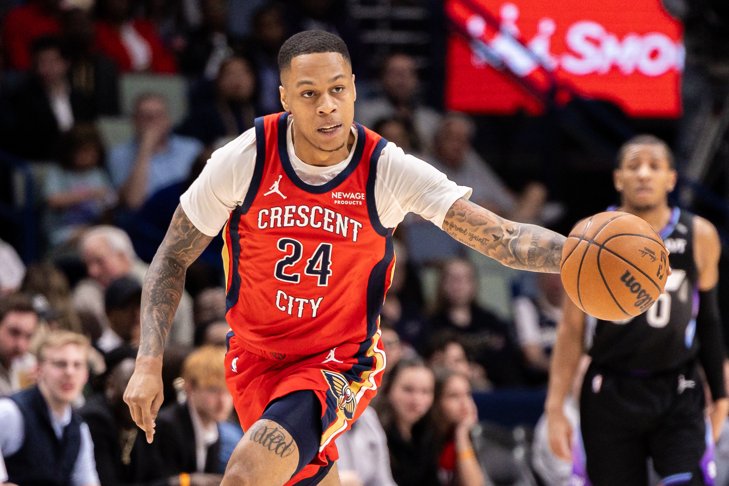 Apr 7, 2026; New Orleans, Louisiana, USA; New Orleans Pelicans guard Jordan Hawkins (24) dribbles the ball court against the Utah Jazz during the first half at Smoothie King Center. Mandatory Credit: Stephen Lew-Imagn Images