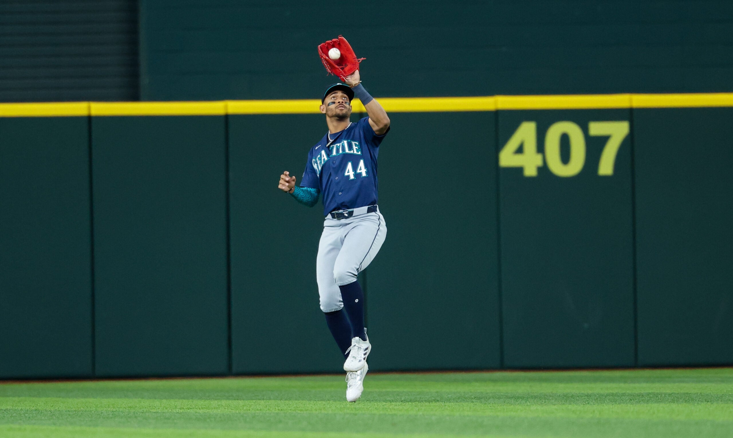 Apr 7, 2026; Arlington, Texas, USA; Seattle Mariners center fielder Julio Rodriguez (44) makes a catch during the seventh inning against the Texas Rangers at Globe Life Field. Mandatory Credit: Kevin Jairaj-Imagn Images