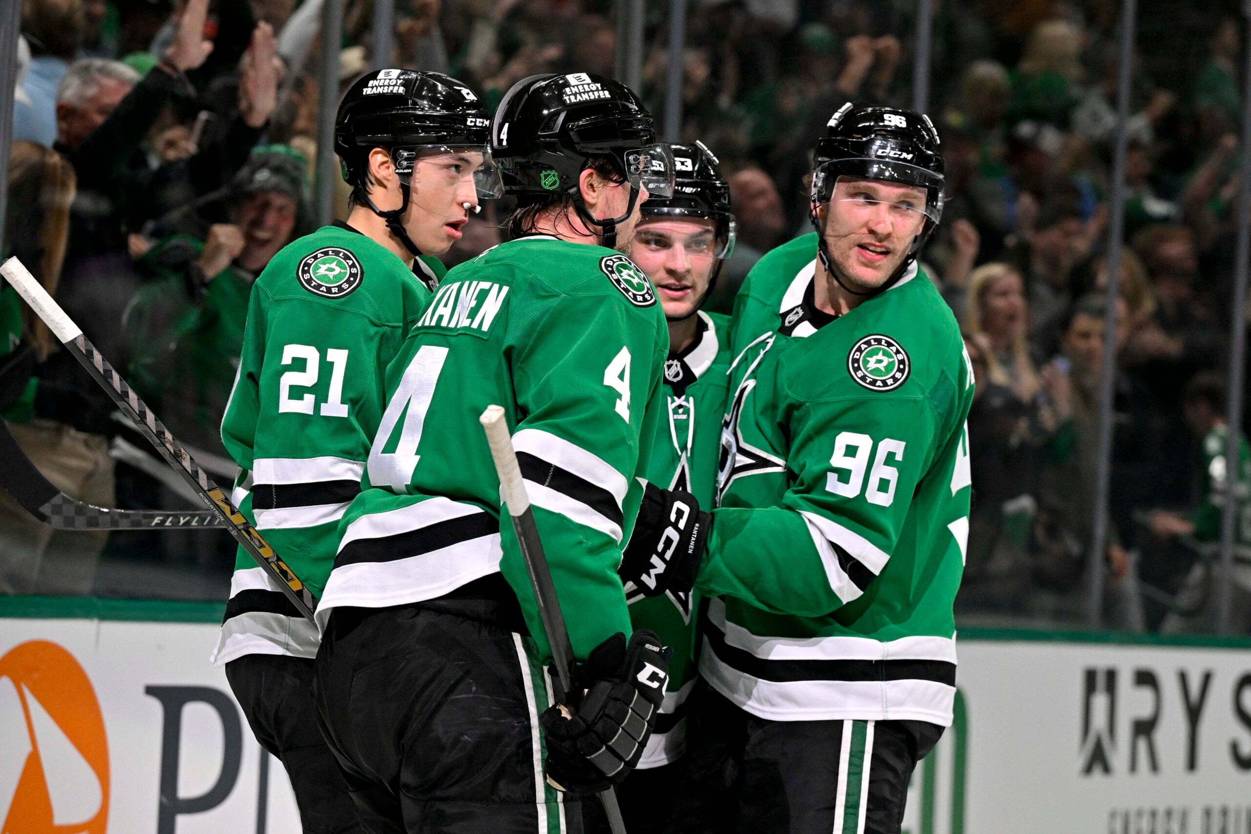 Apr 7, 2026; Dallas, Texas, USA; Dallas Stars defenseman Miro Heiskanen (4) and left wing Jason Robertson (21) and center Wyatt Johnston (53) and right wing Mikko Rantanen (96) celebrate after Johnston scores the game winning power-play goal against Calgary Flames goaltender Devin Cooley (not pictured) during the overtime period at the American Airlines Center. Mandatory Credit: Jerome Miron-Imagn Images