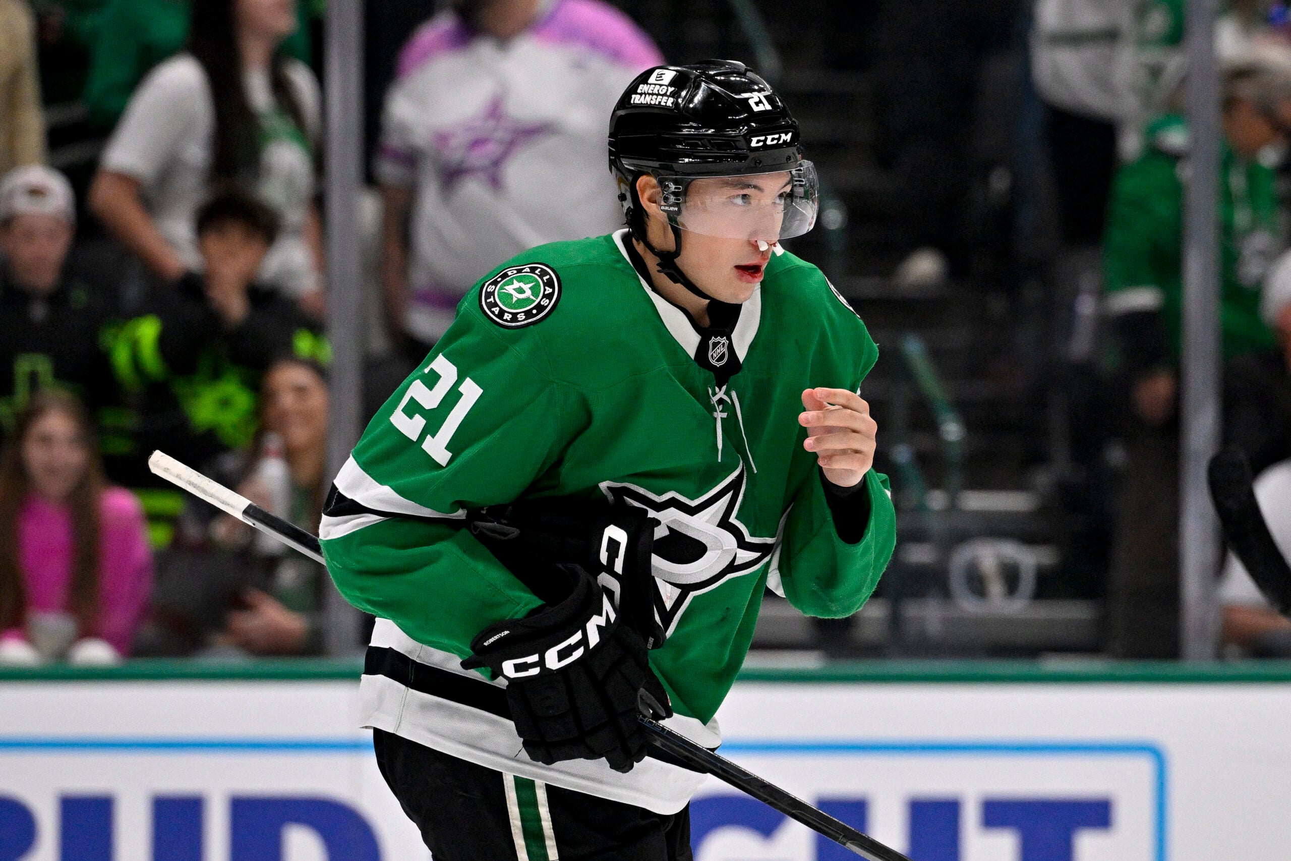 Apr 7, 2026; Dallas, Texas, USA; Dallas Stars left wing Jason Robertson (21) skates with plugs in his nose after he is hit with the high stick o Calgary Flames center Ryan Strome (not pictured) during the overtime period at the American Airlines Center. Mandatory Credit: Jerome Miron-Imagn Images