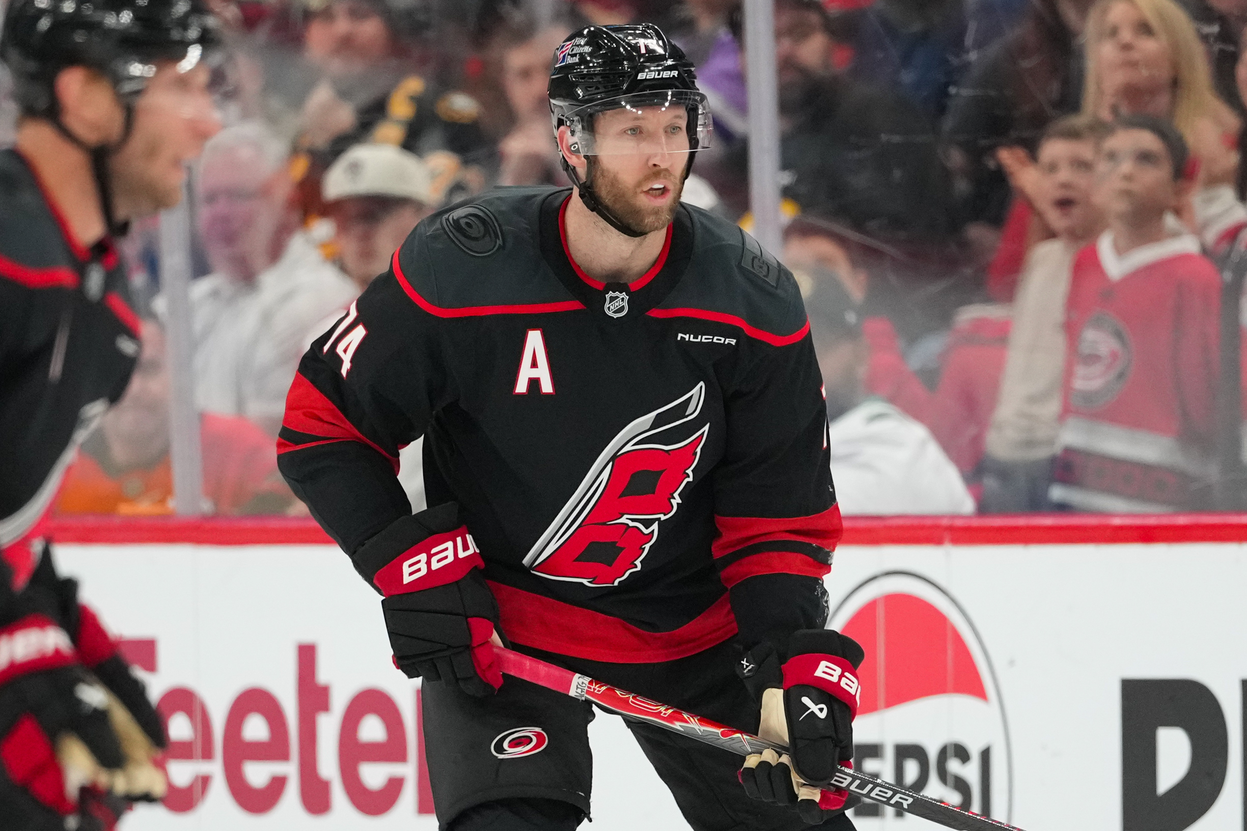 Apr 7, 2026; Raleigh, North Carolina, USA;  Carolina Hurricanes defenseman Jaccob Slavin (74) watches the play against the Boston Bruins during the third period at Lenovo Center. Mandatory Credit: James Guillory-Imagn Images