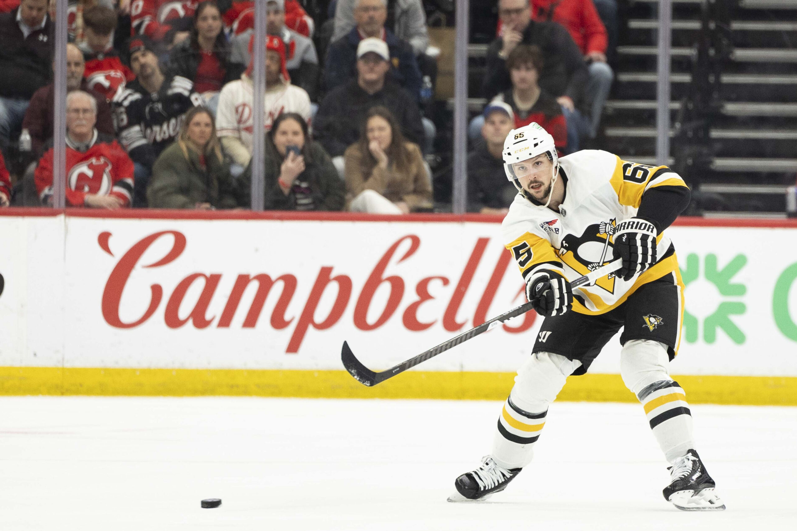 Apr 9, 2026; Newark, New Jersey, USA; Pittsburgh Penguins defenseman Erik Karlsson (65) passes the puck against the New Jersey Devils during the first period at Prudential Center. Mandatory Credit: Luther Schlaifer-Imagn Images