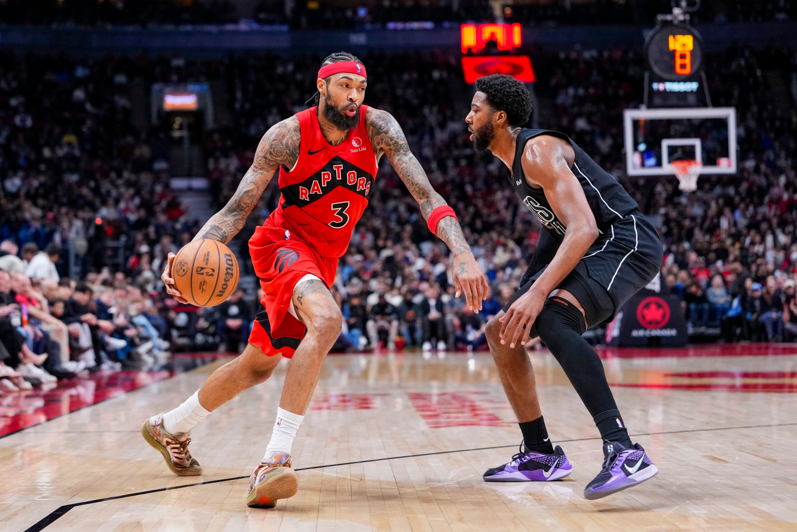 Apr 12, 2026; Toronto, Ontario, CAN;  Toronto Raptors Brandon Ingram (3) dribbles against Brooklyn Nets Chaney Johnson (31) during the second half at Scotiabank Arena. Mandatory Credit: Kevin Sousa-Imagn Images