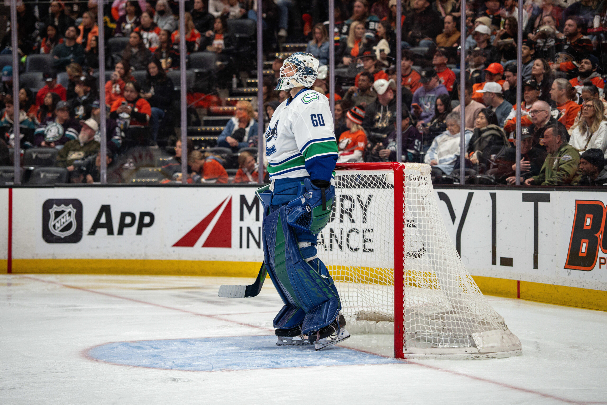 Apr 12, 2026; Anaheim, California, USA;  Vancouver Canucks goaltender Nikita Tolopilo (60) watches a replay during the second period against the Anaheim Ducks at Honda Center. Mandatory Credit: Corinne Votaw-Imagn Images