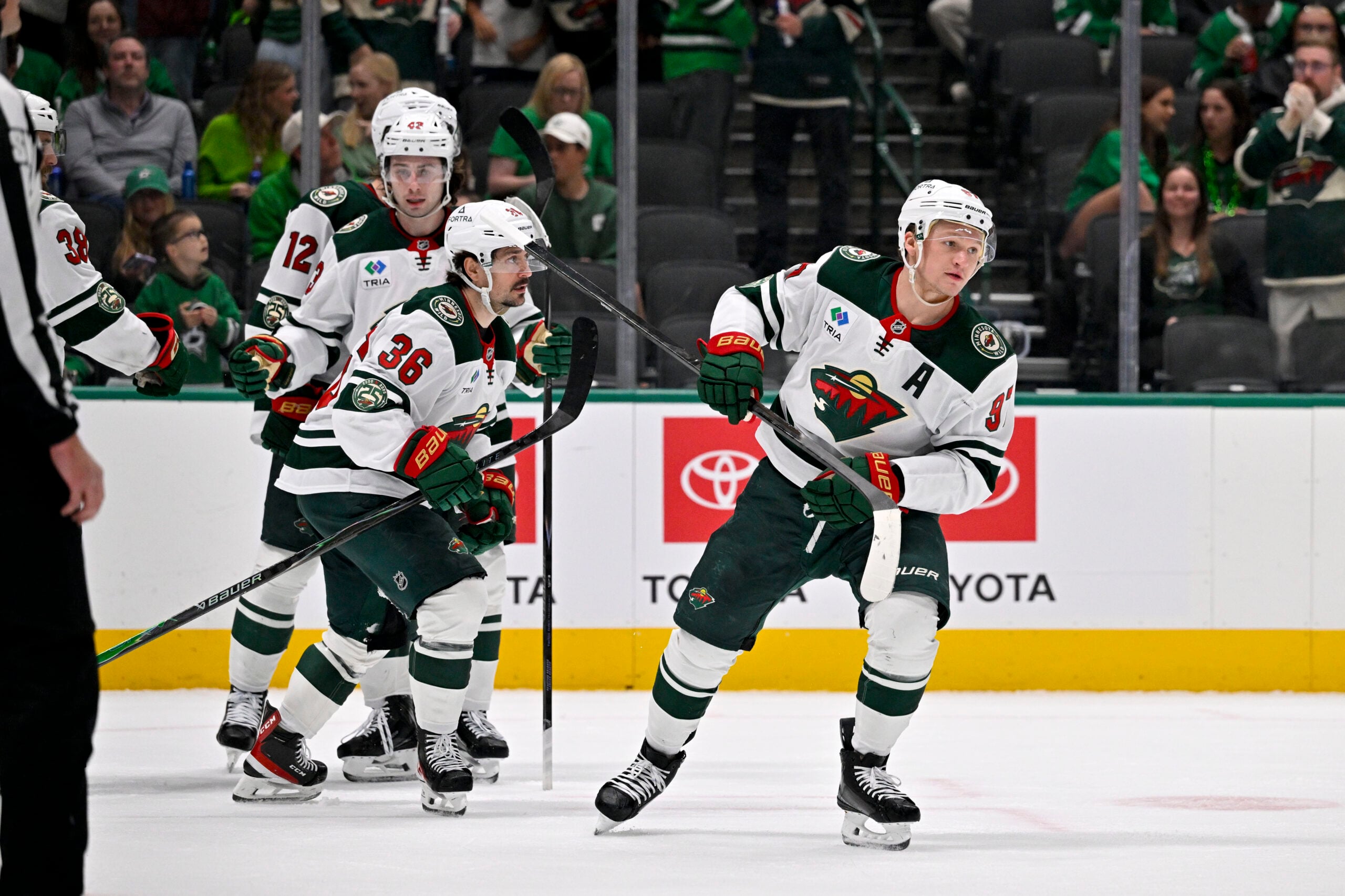 Apr 9, 2026; Dallas, Texas, USA; Minnesota Wild left wing Kirill Kaprizov (97) and left wing Matt Boldy (12) and right wing Ryan Hartman (38) celebrates a goal scored by Kaprizov during the game between the Stars and the Wild at American Airlines Center. Mandatory Credit: Jerome Miron-Imagn Images