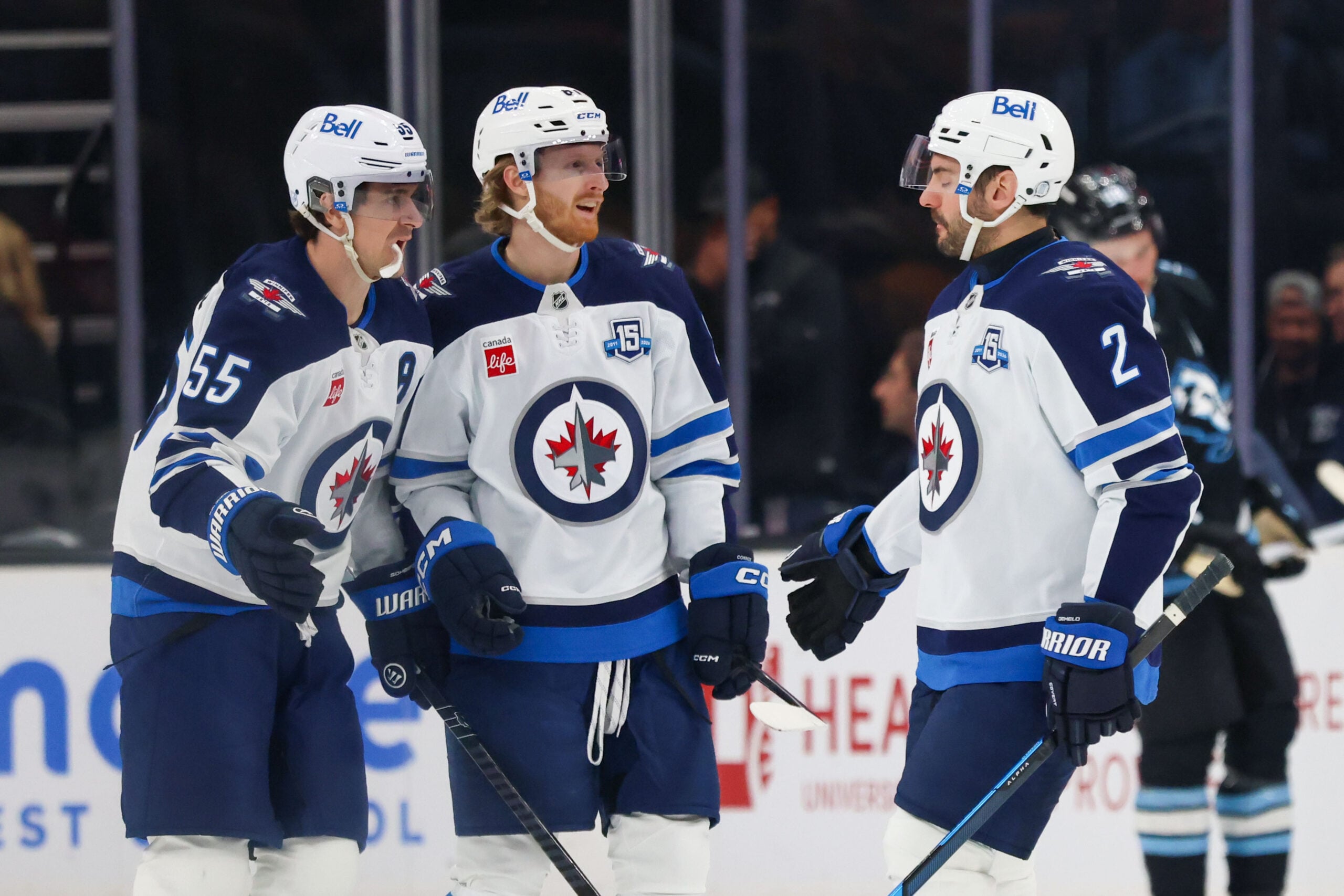 Apr 14, 2026; Salt Lake City, Utah, USA; Winnipeg Jets center Mark Scheifele (55) celebrates with left wing Kyle Connor (81) and defenseman Dylan DeMelo (2) after scoring a goal against the Utah Mammoth during the third period at Delta Center. Mandatory Credit: Rob Gray-Imagn Images