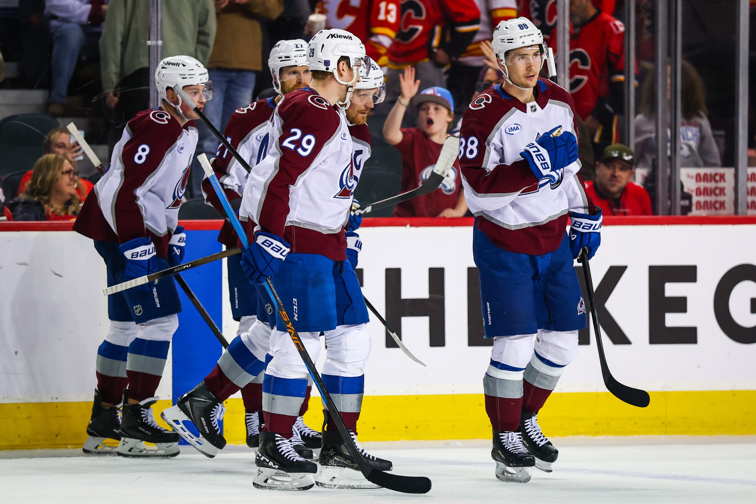 Apr 14, 2026; Calgary, Alberta, CAN; Colorado Avalanche center Nathan MacKinnon (29) celebrates his goal with teammates against the Calgary Flames during the third period at Scotiabank Saddledome. Mandatory Credit: Sergei Belski-Imagn Images