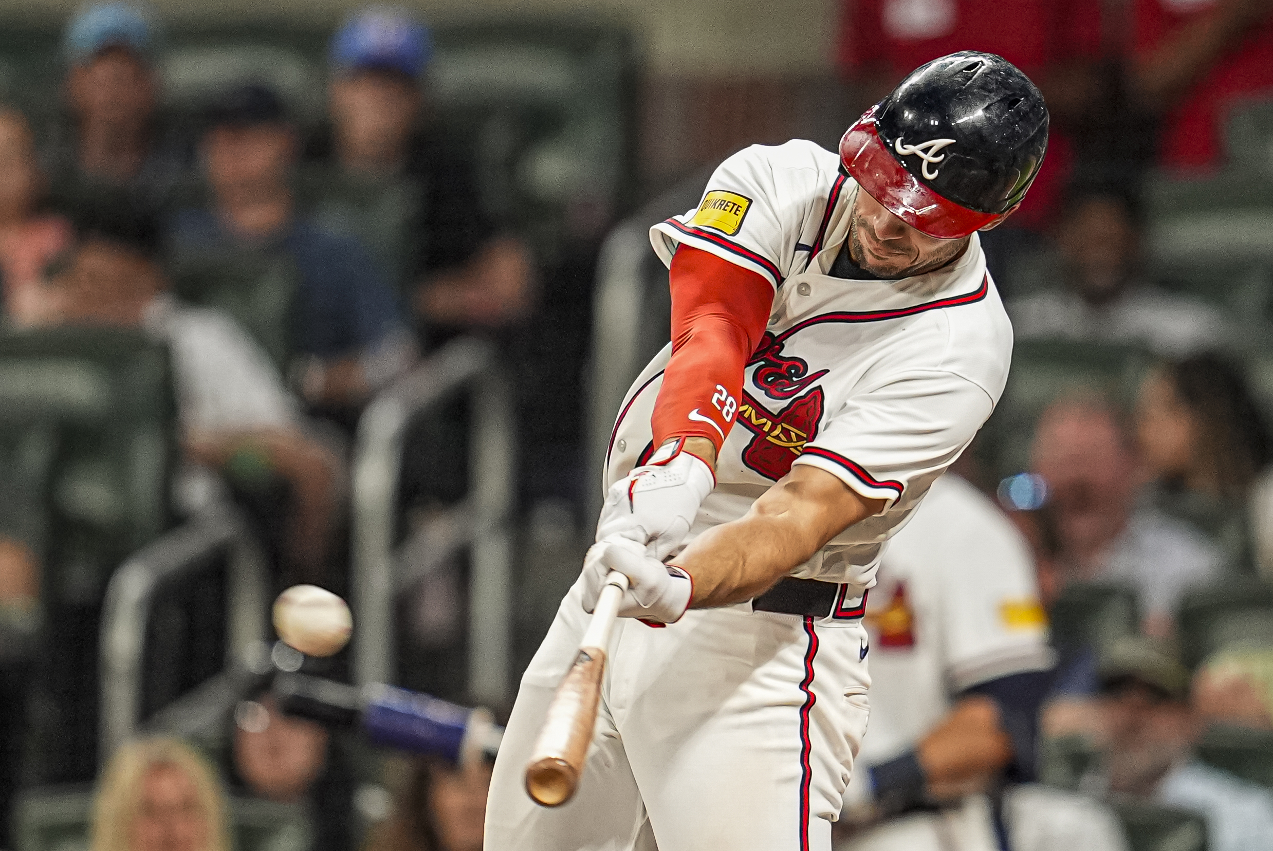 Apr 15, 2026; Cumberland, Georgia, USA; Atlanta Braves first baseman Matt Olson (28) hits a home run against the Miami Marlins during the seventh inning at Truist Park. All players are wearing number 42 today in honor of Jackie Robinson. Mandatory Credit: Dale Zanine-Imagn Images