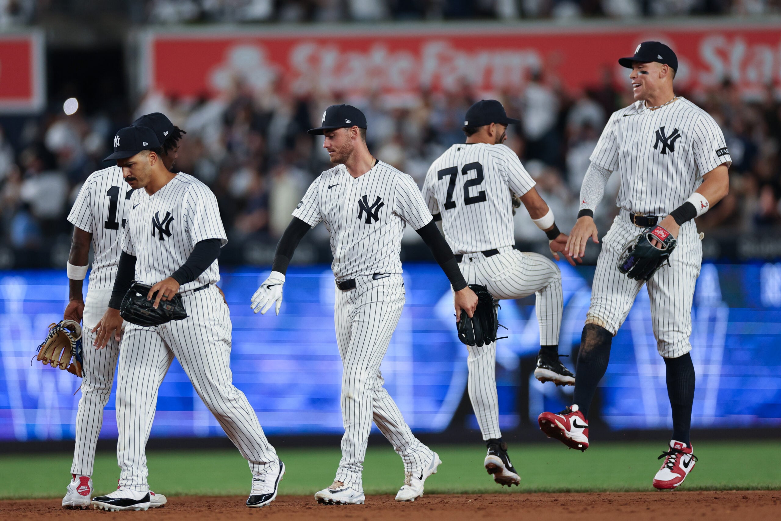 Apr 17, 2026; Bronx, New York, USA; New York Yankees left fielder Cody Bellinger (35) and teammates celebrate after defeating the Kansas City Royals at Yankee Stadium. Mandatory Credit: Vincent Carchietta-Imagn Images