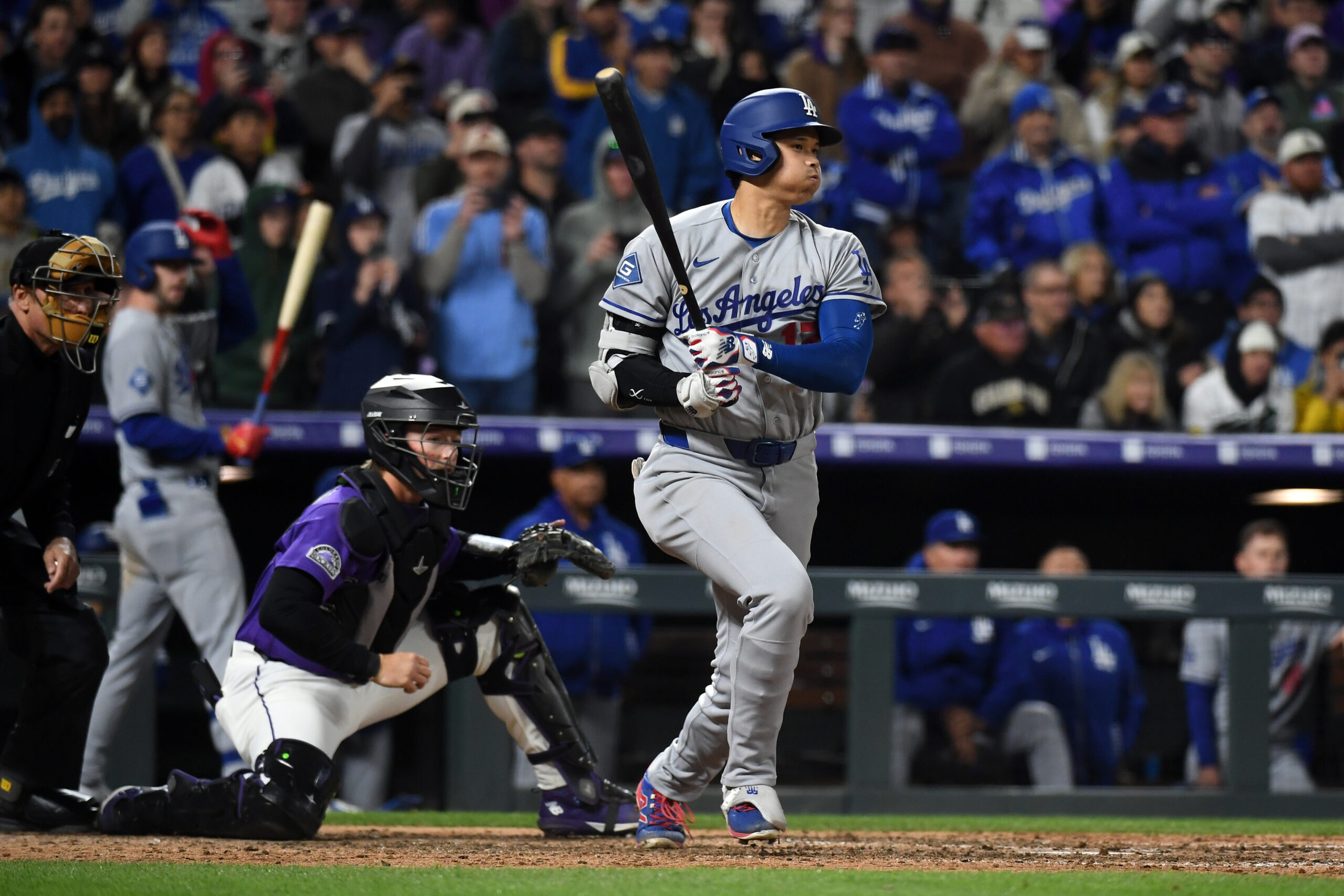 Apr 18, 2026; Denver, Colorado, USA; Los Angeles Dodgers designated hitter Shohei Ohtani (17) singles during the ninth inning against the Los Angeles Dodgers at Coors Field. Mandatory Credit: Christopher Hanewinckel-Imagn Images
