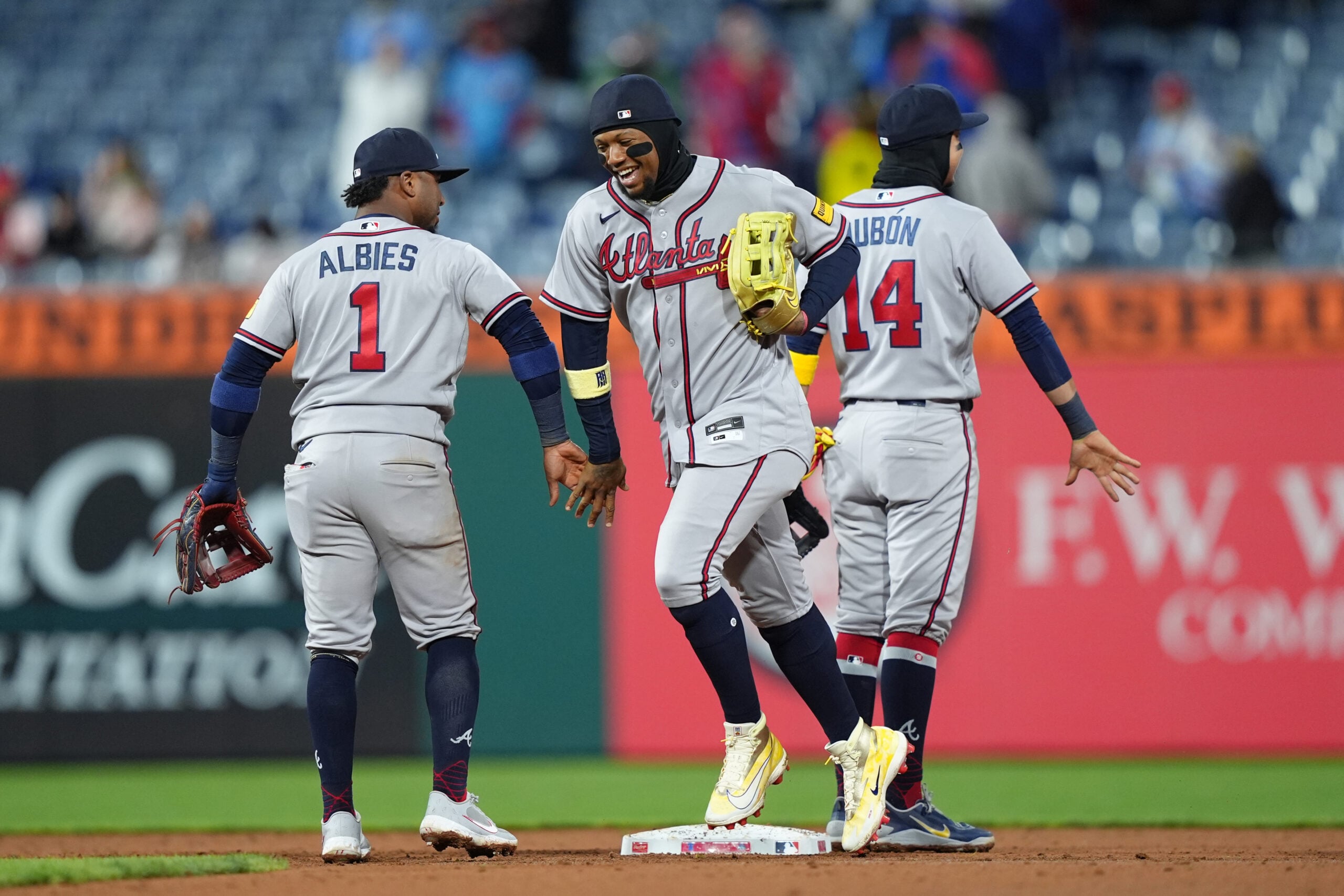 Apr 19, 2026; Philadelphia, Pennsylvania, USA; Atlanta Braves outfielder Ronald Acuna Jr. (13) reacts with infielder Ozzie Albies (1) after the game against the Philadelphia Phillies at Citizens Bank Park. Mandatory Credit: Kyle Ross-Imagn Images