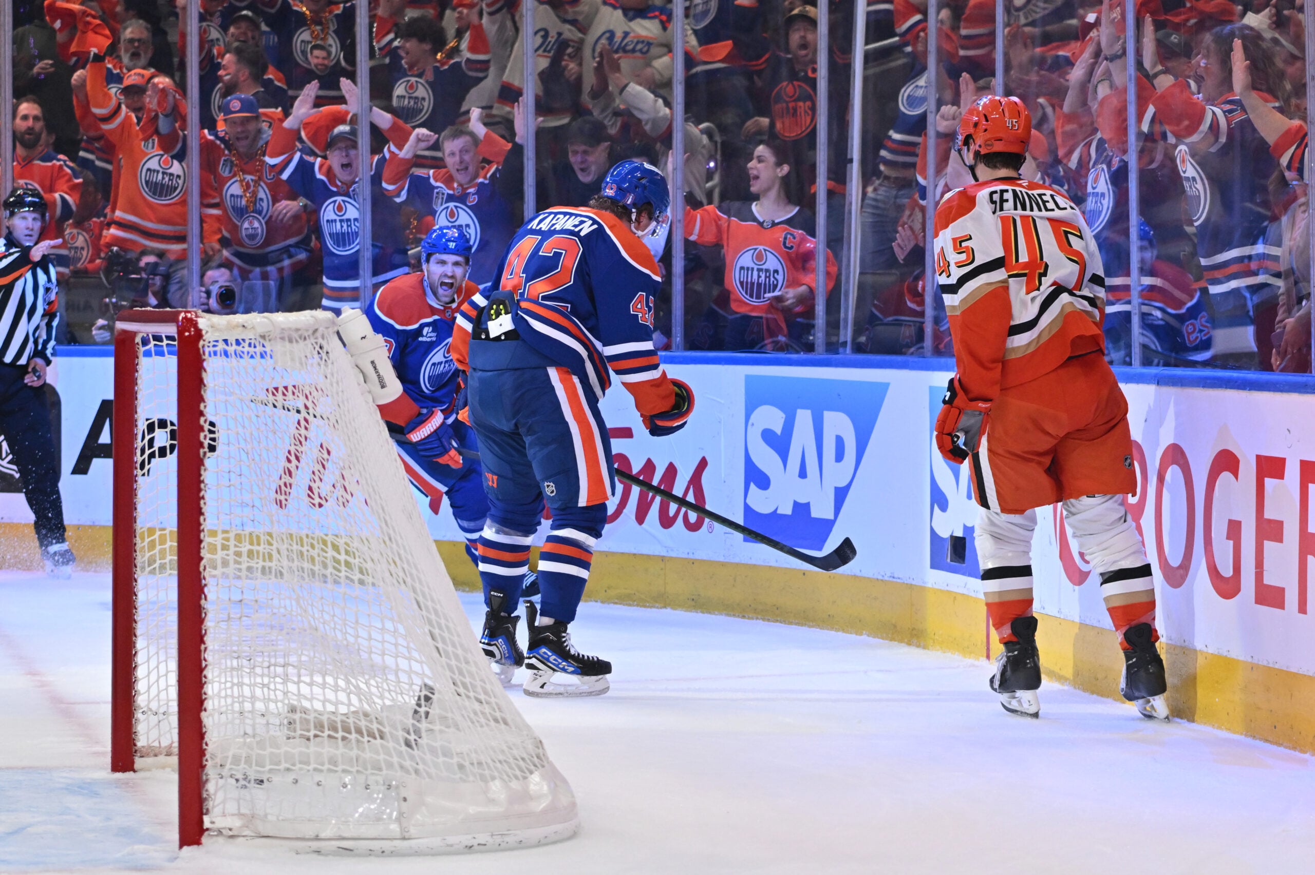 Apr 20, 2026; Edmonton, Alberta, CAN; Edmonton Oilers center Leon Draisaitl (29)  with right winger Kasperi Kapanen (42) celebrate a goal as Anaheim Ducks right winger Beckett Sennecke (45) skates past in game one of the first round of the 2026 Stanley Cup Playoffs during the first period at Rogers Place. Mandatory Credit: Walter Tychnowicz-Imagn Images