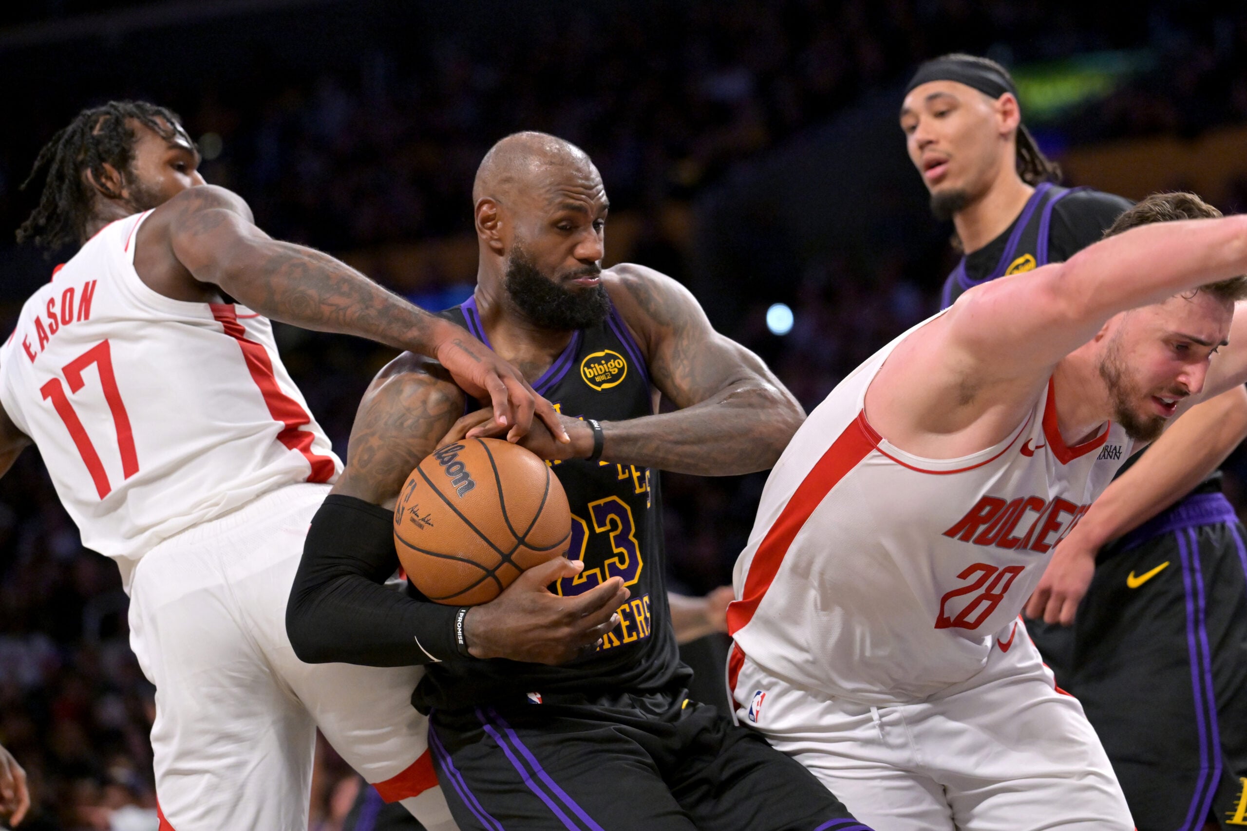 Apr 21, 2026; Los Angeles, California, USA; Houston Rockets forward Tari Eason (17), center Alperen Sengun (28) and Los Angeles Lakers forward LeBron James (23) battle for a rebound during the second half of game two of the first round of the 2026 NBA Playoffs at Crypto.com Arena. Mandatory Credit: Jayne Kamin-Oncea-Imagn Images