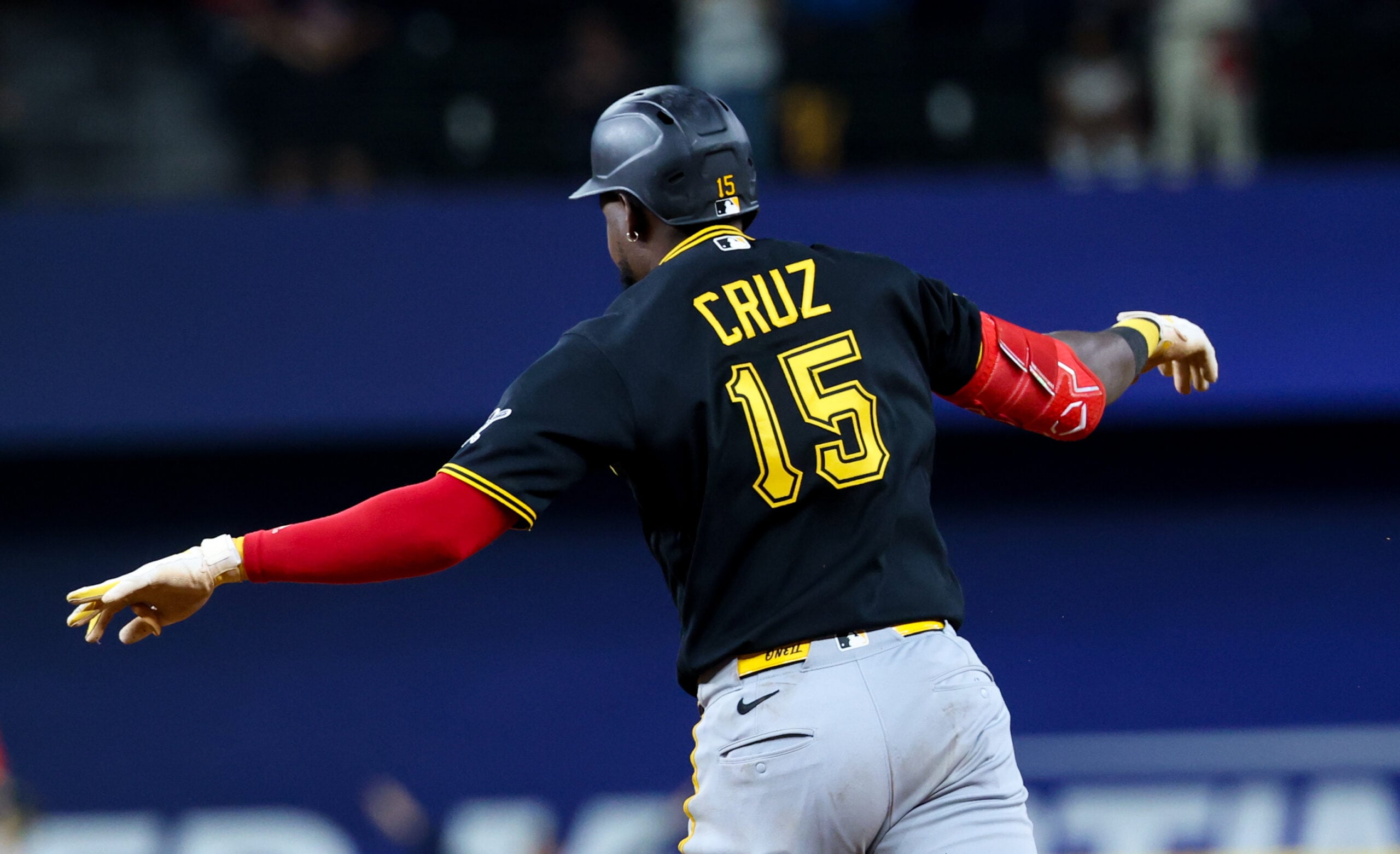 Apr 22, 2026; Arlington, Texas, USA;  Pittsburgh Pirates center fielder Oneil Cruz (15) reacts after hitting a three-run home run during the ninth inning against the Texas Rangers at Globe Life Field. Mandatory Credit: Kevin Jairaj-Imagn Images