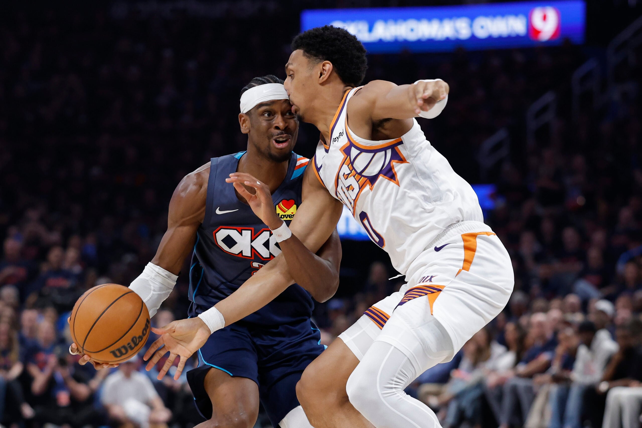 Apr 22, 2026; Oklahoma City, Oklahoma, USA; Oklahoma City Thunder guard Shai Gilgeous-Alexander (2) and Phoenix Suns forward Ryan Dunn (0) run into each other on a drive in the second half during game two of the first round of the 2026 NBA Playoffs at Paycom Center. Mandatory Credit: Alonzo Adams-Imagn Images