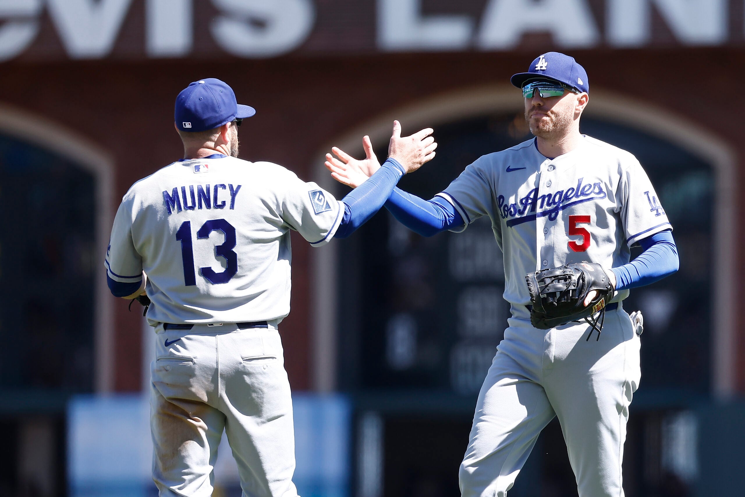 Apr 23, 2026; San Francisco, California, USA; Los Angeles Dodgers third baseman Max Muncy (13) celebrates with first baseman Freddie Freeman (5) after the game against the San Francisco Giants at Oracle Park. Mandatory Credit: Kelley L Cox-Imagn Images