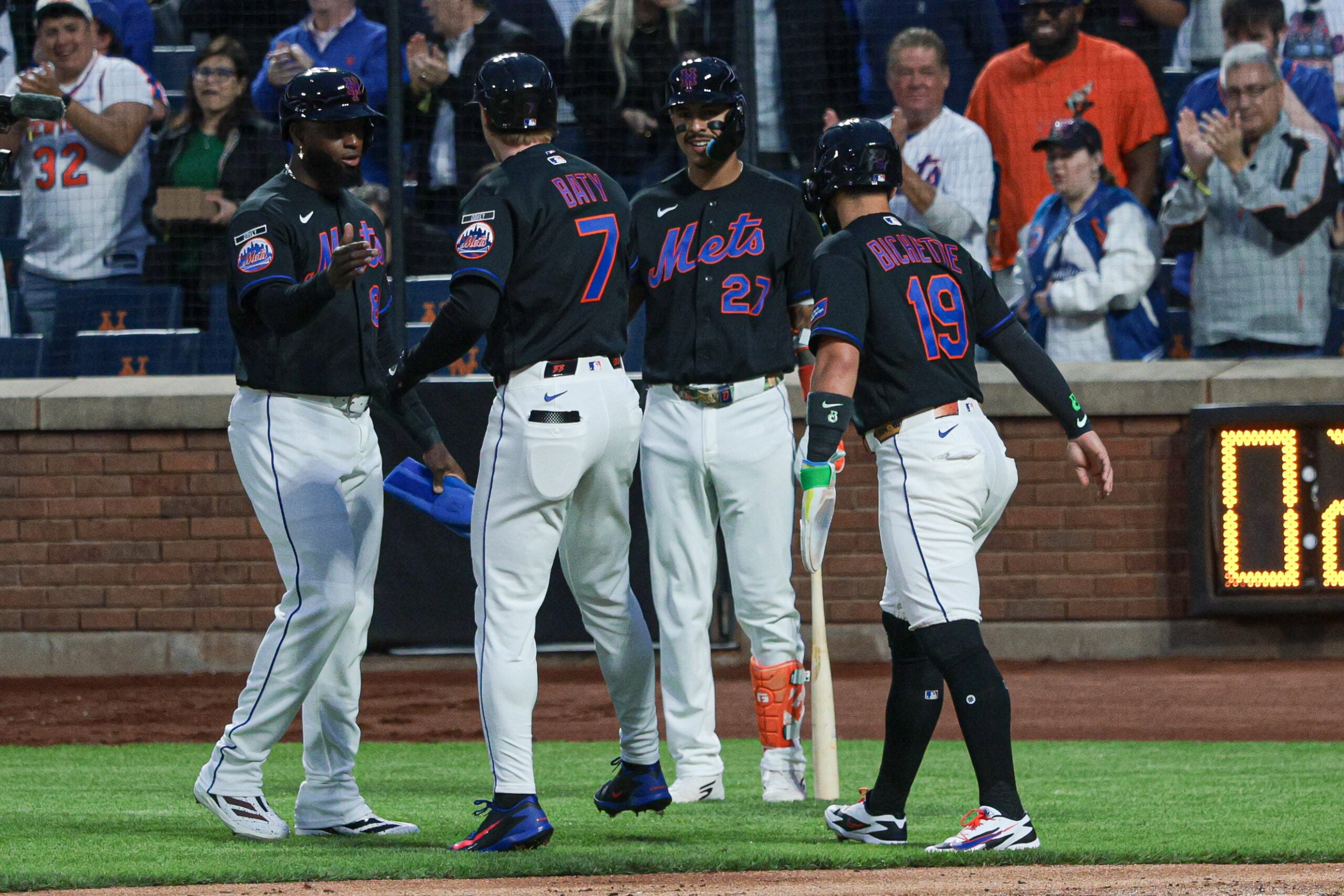 Apr 23, 2026; New York City, New York, USA;  New York Mets third baseman Brett Baty (7)celebrates with teammates after hitting a three run home run during the first inning against the Minnesota Twins at Citi Field. Mandatory Credit: Vincent Carchietta-Imagn Images
