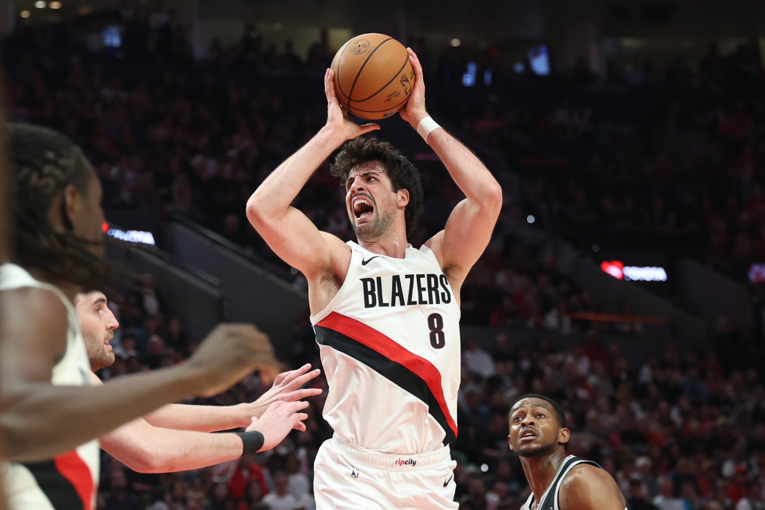 Apr 24, 2026; Portland, Oregon, USA; Portland Trail Blazers forward Deni Avdija (8) reacts after drawing a foul on San Antonio Spurs guard De'aaron Fox (4) during the first half during game three of the first round of the 2026 NBA Playoffs at Moda Center. Mandatory Credit: Jaime Valdez-Imagn Images