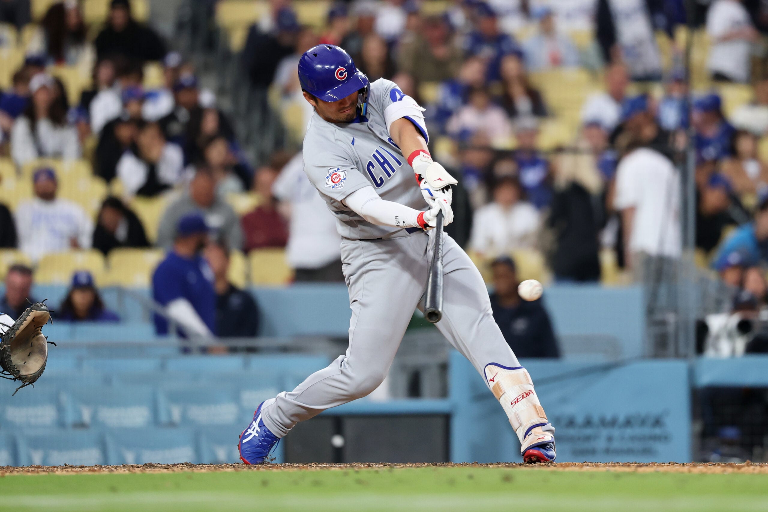Apr 25, 2026; Los Angeles, California, USA; Chicago Cubs outfielder Seiya Suzuki (27) hits a single against the Los Angeles Dodgers during the eighth inning at Dodger Stadium. Mandatory Credit: Kiyoshi Mio-Imagn Images