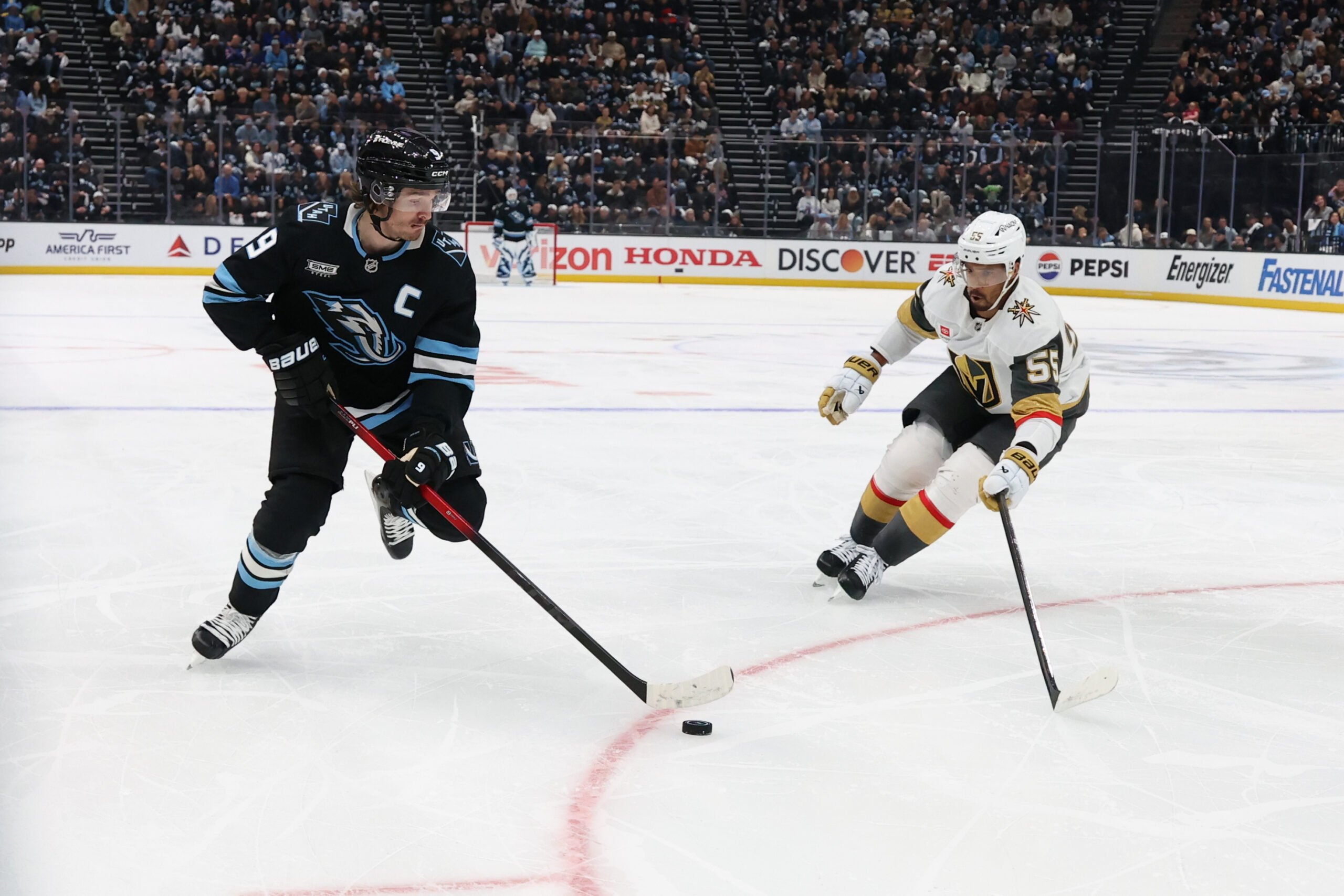 Apr 27, 2026; Salt Lake City, Utah, USA; Utah Mammoth right wing Clayton Keller (9) skates with the puck against Vegas Golden Knights right wing Keegan Kolesar (55) during the first period in game four of the first round of the 2026 Stanley Cup Playoffs at Delta Center. Mandatory Credit: Rob Gray-Imagn Images