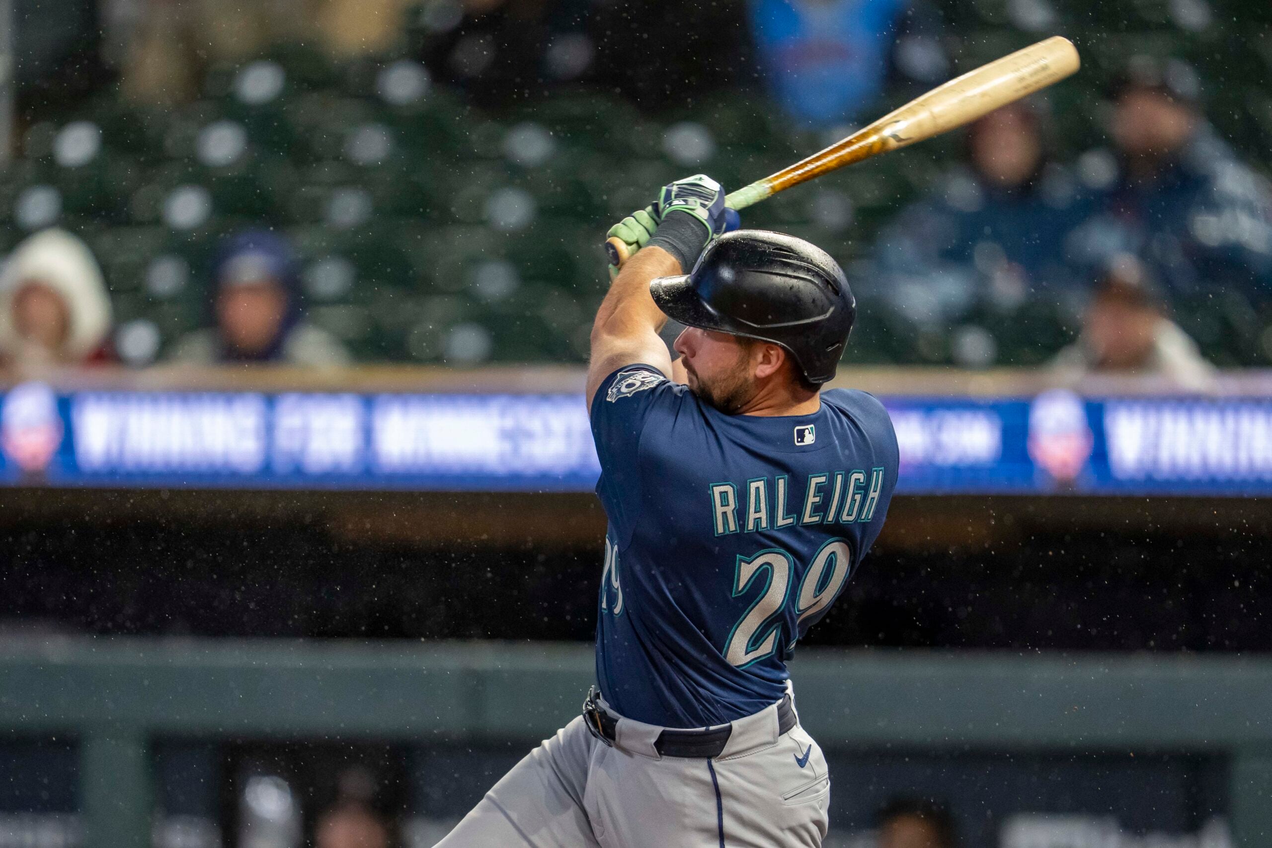 Apr 27, 2026; Minneapolis, Minnesota, USA; Seattle Mariners designated hitter Cal Raleigh (29) hits a two run home run against the Minnesota Twins in the eighth inning at Target Field. Mandatory Credit: Jesse Johnson-Imagn Images
