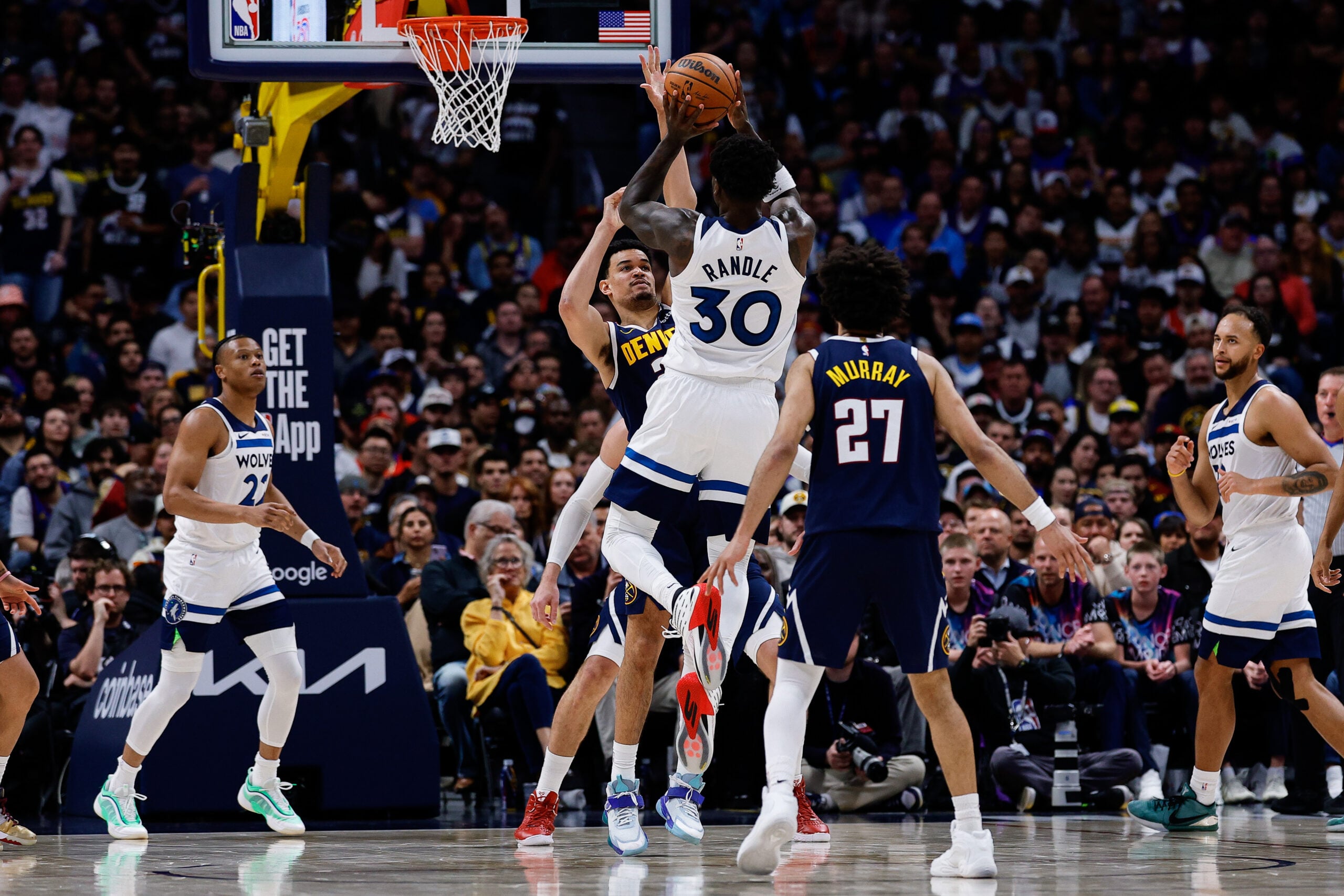 Apr 27, 2026; Denver, Colorado, USA; Minnesota Timberwolves forward Julius Randle (30) attempts a shot against Denver Nuggets forward Spencer Jones (21) as guard Jamal Murray (27) defends in the fourth quarter during game five of the first round of the 2026 NBA Playoffs at Ball Arena. Mandatory Credit: Isaiah J. Downing-Imagn Images