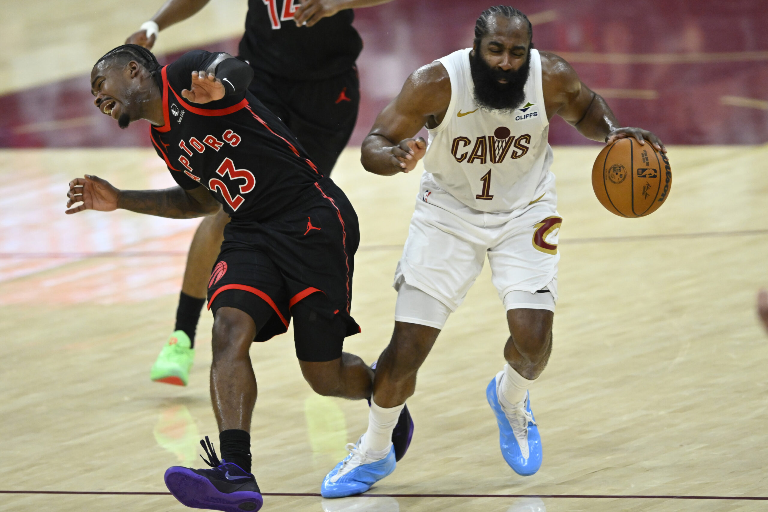 Apr 29, 2026; Cleveland, Ohio, USA; Toronto Raptors guard Jamal Shead (23) defends Cleveland Cavaliers guard James Harden (1) in the fourth quarter of game five of the first round of the 2026 NBA Playoffs at Rocket Arena. Mandatory Credit: David Richard-Imagn Images