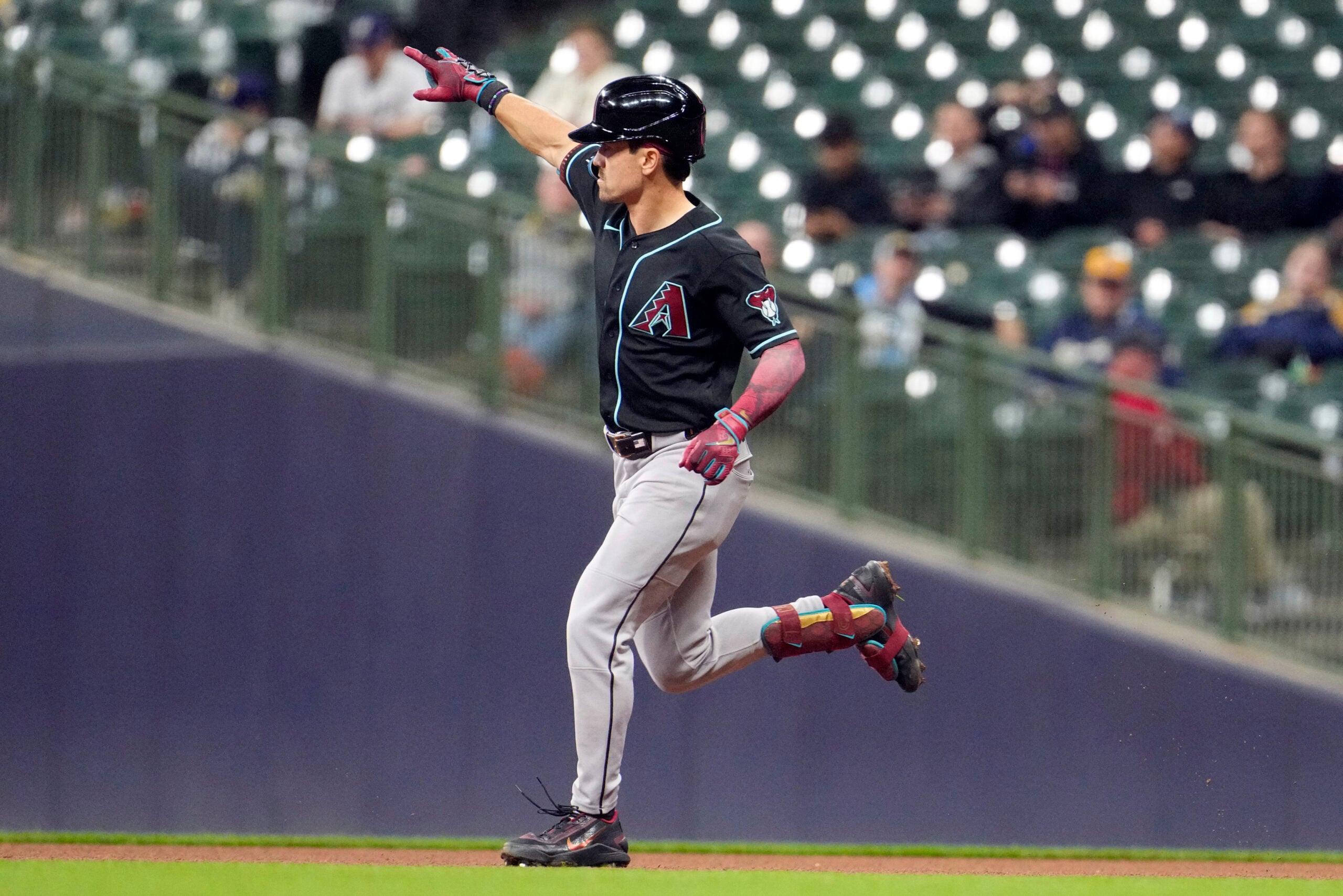 Apr 29, 2026; Milwaukee, Wisconsin, USA; Arizona Diamondbacks right fielder Corbin Carroll (7) rounds the bases after hitting a home run against the Milwaukee Brewers in the ninth inning at American Family Field. Mandatory Credit: Michael McLoone-Imagn Images