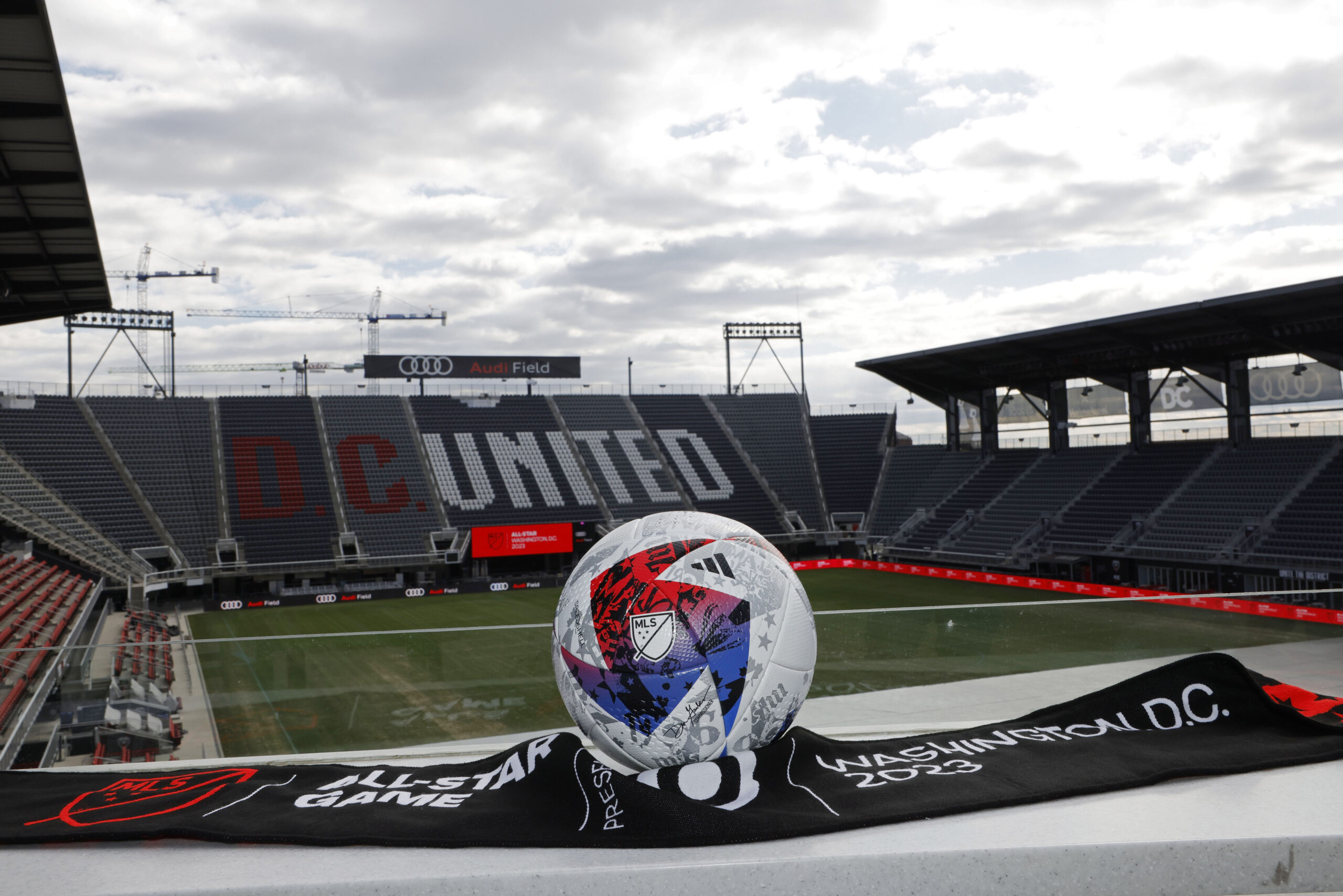 Mar 14, 2023; Washington, DC, USA; A view of an official MLS game ball and an All Star scarf after an announcement that Premier League club Arsenal will play the MLS All Stars at the MLS All-Star Game in Washington D.C at Audi Field. Mandatory Credit: Geoff Burke-Imagn Images
