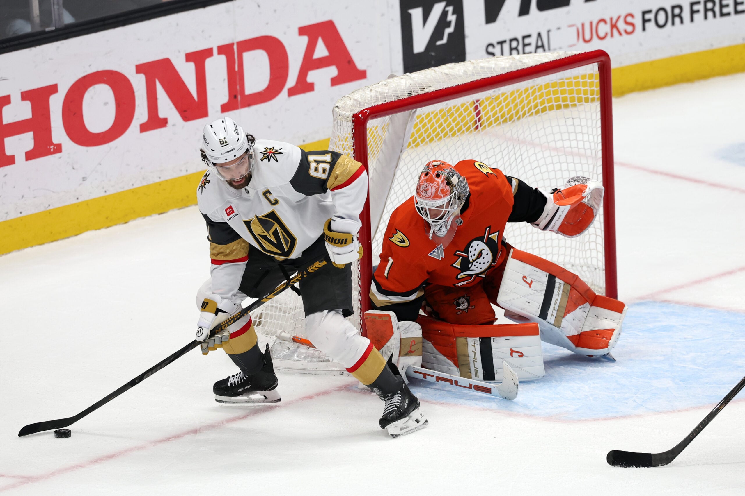 Feb 1, 2026; Anaheim, California, USA;  Vegas Golden Knights right wing Mark Stone (61) controls the puck against Anaheim Ducks goaltender Lukas Dostal (1) during the third period at Honda Center. Mandatory Credit: Kiyoshi Mio-Imagn Images