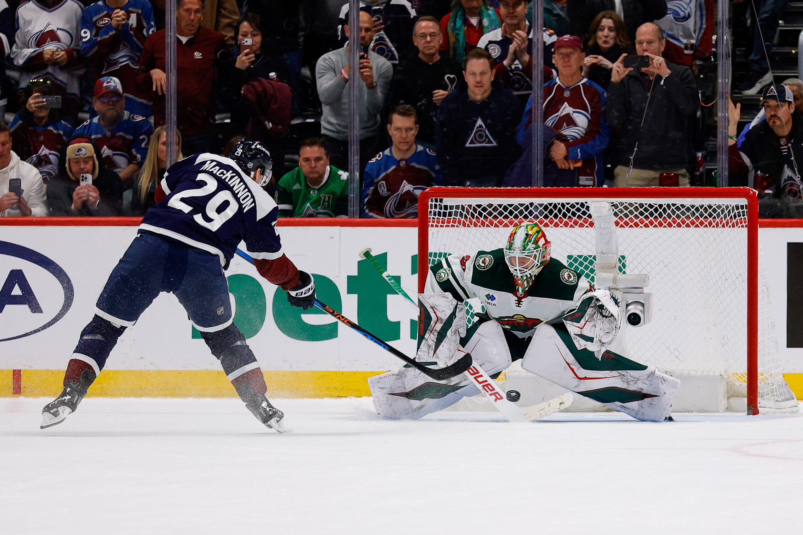 Mar 8, 2026; Denver, Colorado, USA; Colorado Avalanche center Nathan MacKinnon (29) scores a shootout goal against Minnesota Wild goaltender Jesper Wallstedt (30) at Ball Arena. Mandatory Credit: Isaiah J. Downing-Imagn Images