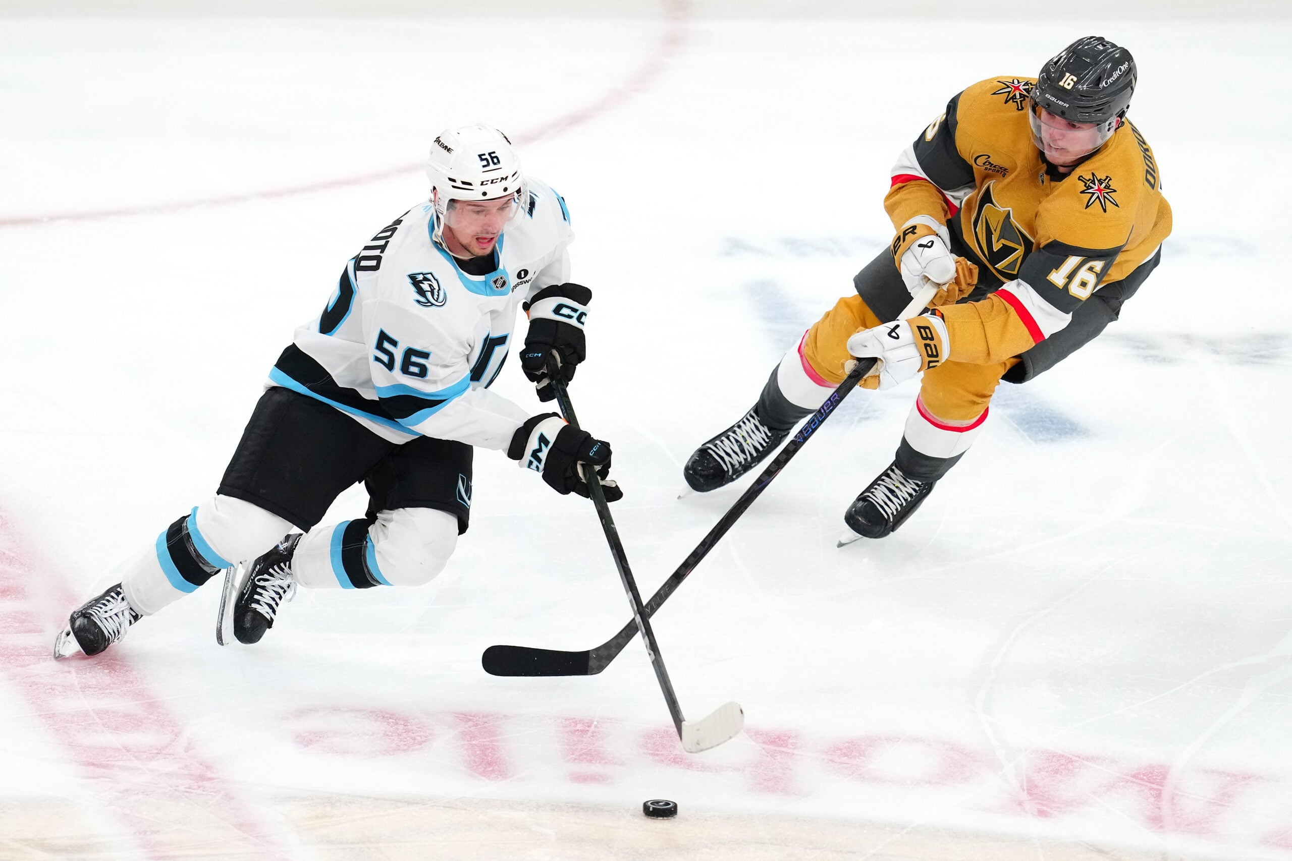 Apr 29, 2026; Las Vegas, Nevada, USA; Utah Mammoth right wing Kailer Yamamoto (56) skates around Vegas Golden Knights right wing Pavel Dorofeyev (16) during the first overtime period of game five of the first round of the 2026 Stanley Cup Playoffs at T-Mobile Arena. Mandatory Credit: Stephen R. Sylvanie-Imagn Images