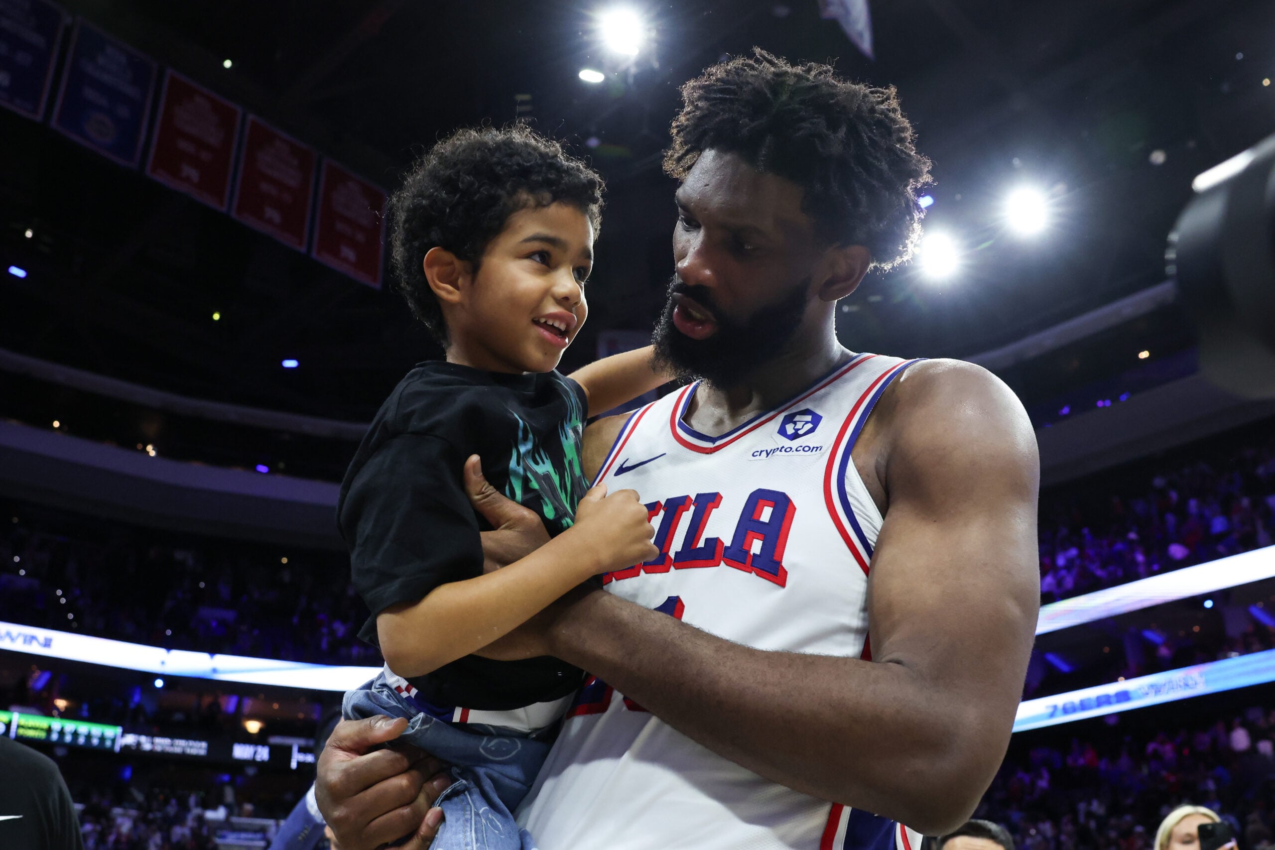 Apr 30, 2026; Philadelphia, Pennsylvania, USA; Philadelphia 76ers center Joel Embiid (21) carries his son Arthur on the court after a victory against the Boston Celtics at Xfinity Mobile Arena. Mandatory Credit: Bill Streicher-Imagn Images