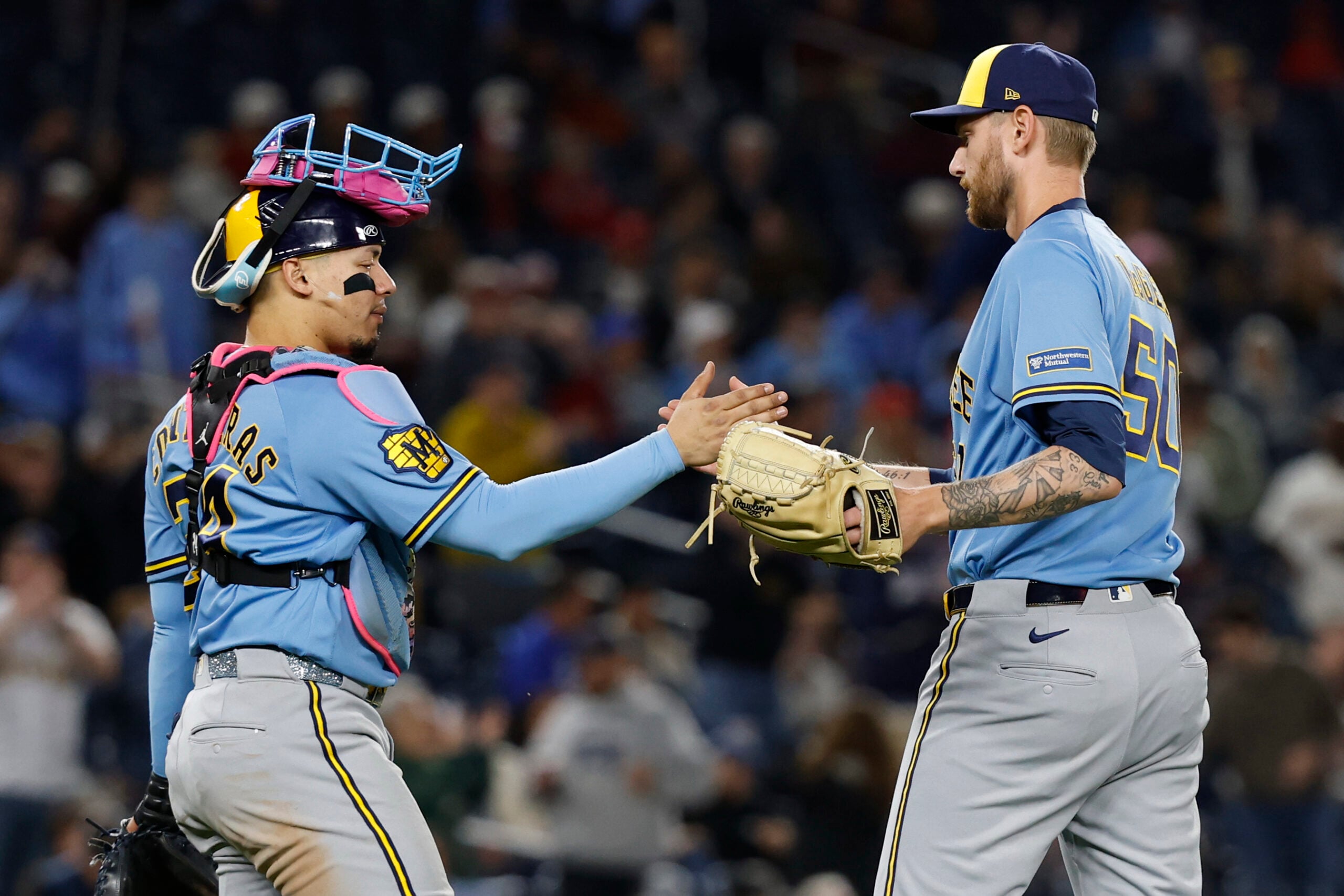 May 1, 2026; Washington, District of Columbia, USA; Milwaukee Brewers catcher William Contreras (24) celebrates with Brewers relief pitcher Easton McGee (50) after the final out against the Washington Nationals at Nationals Park. Mandatory Credit: Geoff Burke-Imagn Images