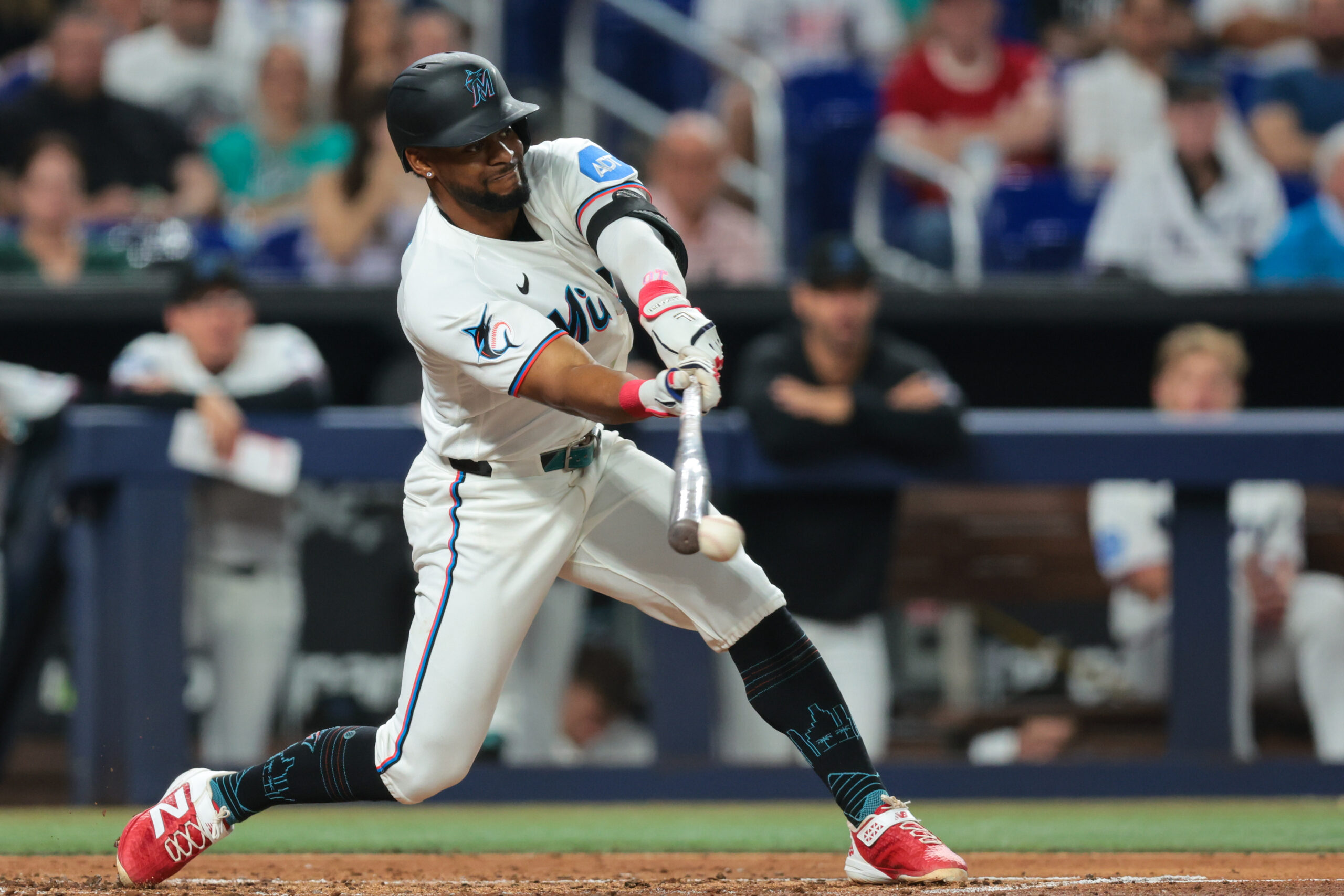 May 4, 2026; Miami, Florida, USA; Miami Marlins shortstop Otto Lopez (6) hits a single against the Philadelphia Phillies during the fourth inning at loanDepot Park. Mandatory Credit: Sam Navarro-Imagn Images