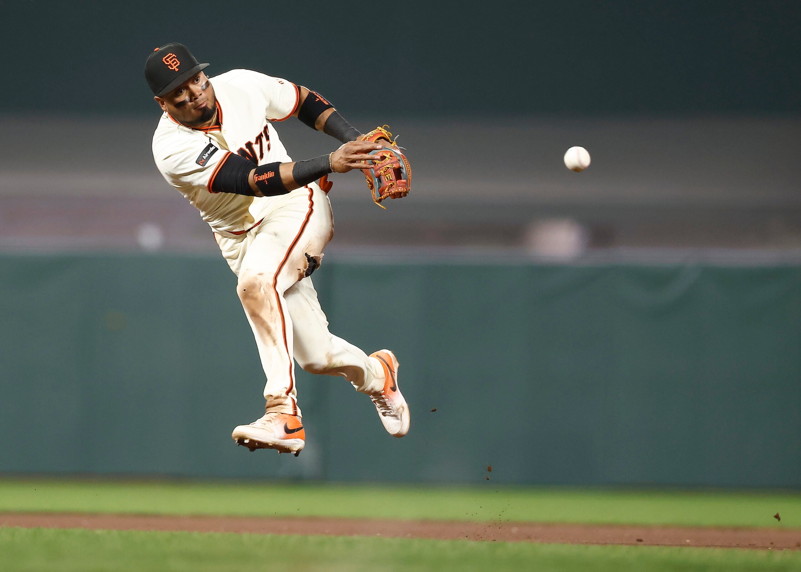 May 4, 2026; San Francisco, California, USA; San Francisco Giants second baseman Luis Arraez (1) throws the ball to first base against the San Diego Padres during the ninth inning at Oracle Park. Mandatory Credit: Kelley L Cox-Imagn Images