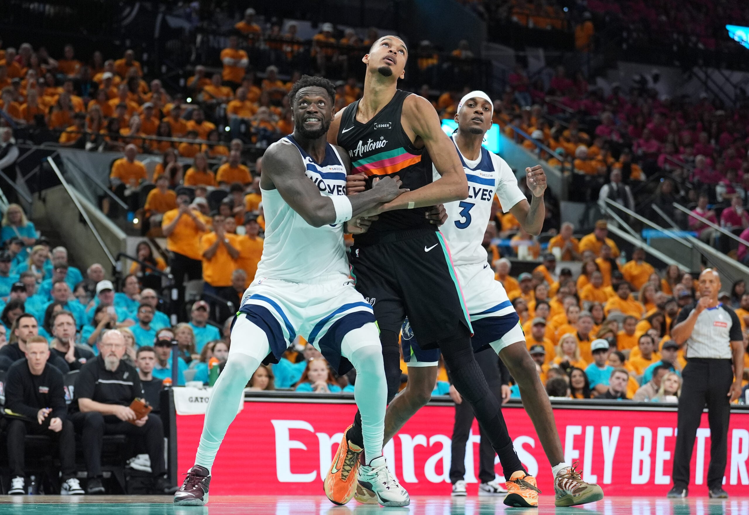 May 4, 2026; San Antonio, Texas, USA; Minnesota Timberwolves forwards Julius Randle (30) and Jaden McDaniels (3) try to keep San Antonio Spurs forward Victor Wembanyama (1) back in the second half during game one of the second round of the 2026 NBA Playoffs at Frost Bank Center. Mandatory Credit: Daniel Dunn-Imagn Images