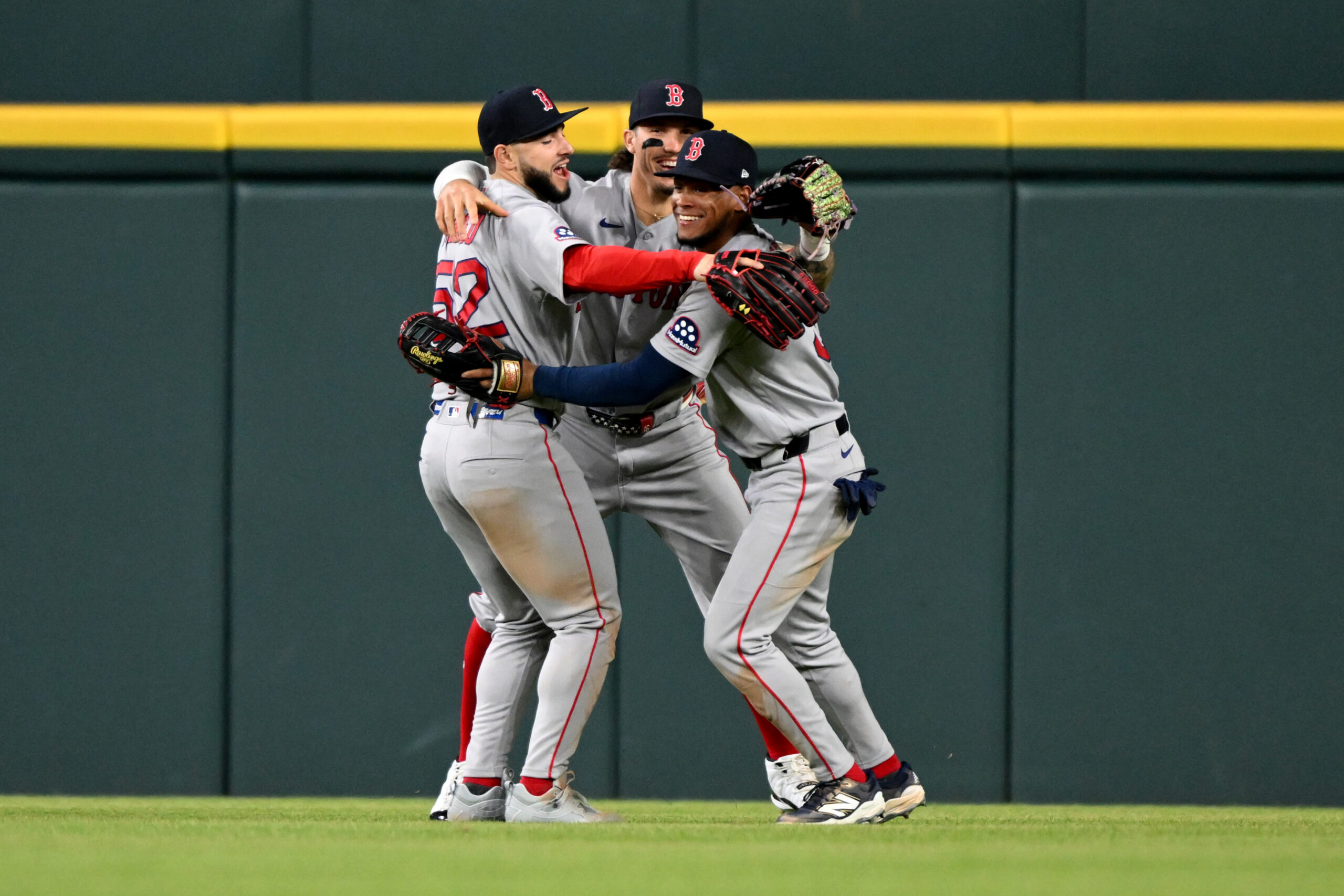 May 5, 2026; Detroit, Michigan, USA; Boston Red Sox outfielders Wilyer Abreu (52), Jarren Duran (16) and Ceddanne Rafaela (3) celebrate their win over the Detroit Tigers at Comerica Park. Mandatory Credit: Lon Horwedel-Imagn Images