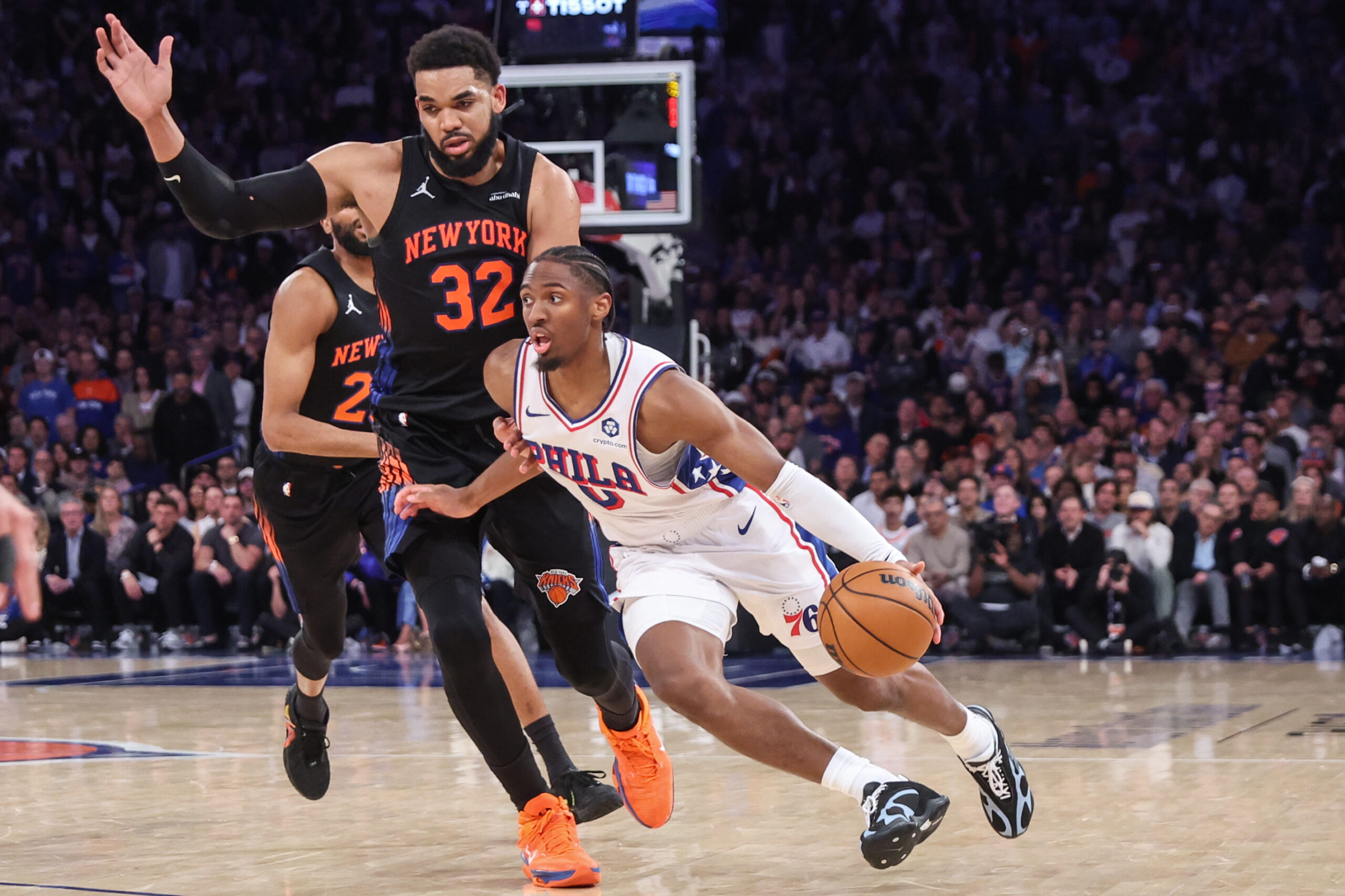 May 6, 2026; New York, New York, USA; Philadelphia 76ers guard Tyrese Maxey (0) drives past New York Knicks center Karl-Anthony Towns (32) during game five of the second round of the 2026 NBA Playoffs at Madison Square Garden. Mandatory Credit: Wendell Cruz-Imagn Images